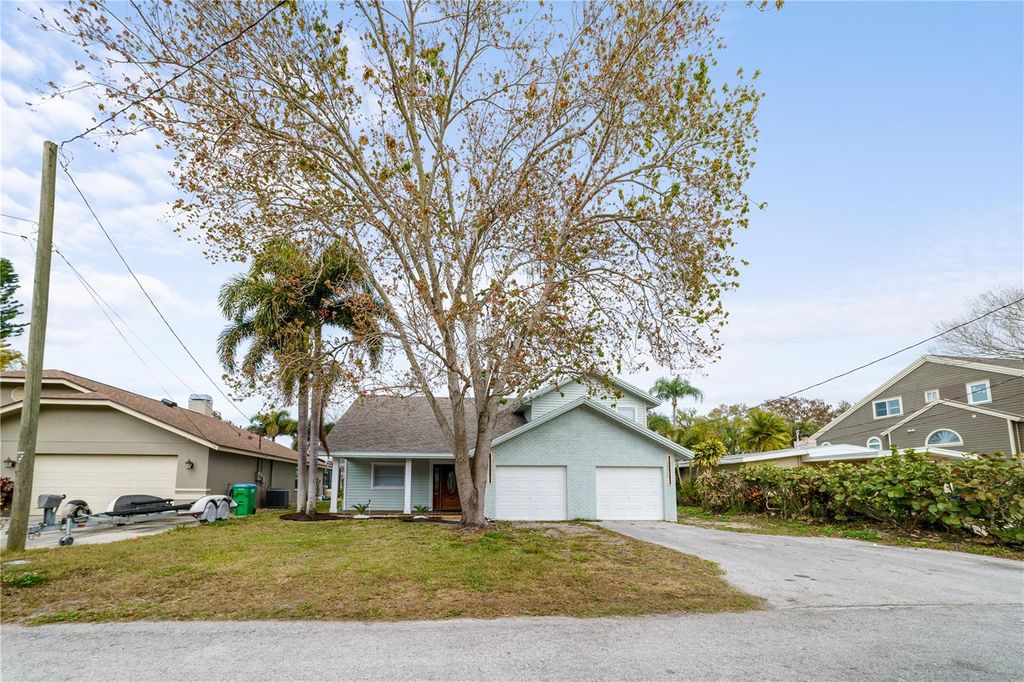 Photo of 3149 N Canal Drive, Palm Harbor, FL 34684 (MLS # TB8481430)