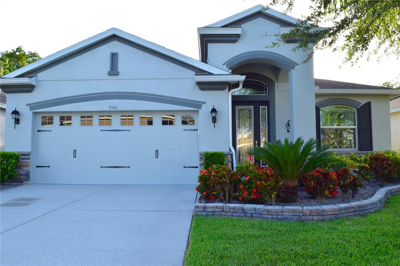 Move-in Ready 3 Bedroom, 2 Bath Home with Serene Pond Views! Built in 2017, this beautifully maintained home offers a split-bedroom floorplan and a peaceful backdrop of pond and conservation views. The kitchen features elegant cabinetry, granite countertops, tiled backsplash, and sleek black stainless steel appliances. Tile flooring runs throughout the main living areas, while both guest bedrooms have been upgraded with new laminate flooring. The primary suite includes grab bars for added safety, an updated ceiling fan, re-tiled shower floor, and modernized faucets. Additional upgrades include resealed grout throughout the home, new patio doors, and a recently replaced A/C capacitor (2024). The exterior was freshly painted and fitted with new gutters in 2024, and the water softener was recently rebedded. Enjoy upscale yet simple landscaping and the convenience of HOA-covered services including cable, internet, lawn care, and access to incredible amenities: swimming pools, fitness center, pickleball and tennis courts. This vibrant community also features a golf course, restaurant, and pub—everything you need for an active and social lifestyle. Furniture and Golf Cart also available for sale outside of the purchase contract. Come view this home today!!