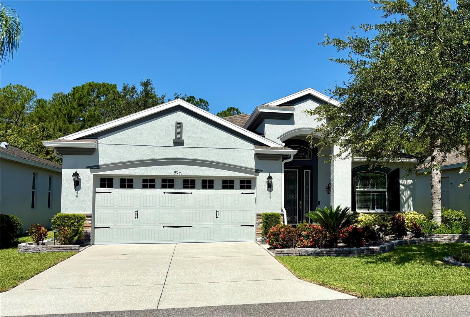 Move-in Ready 3 Bedroom, 2 Bath Home with Serene Pond Views! Built in 2017, this beautifully maintained home offers a split-bedroom floorplan and a peaceful backdrop of pond and conservation views. The kitchen features elegant cabinetry, granite countertops, tiled backsplash, and sleek black stainless steel appliances - New Refrigerator, Microwave, and Dishwasher. Tile flooring runs throughout the main living areas, while both guest bedrooms have been upgraded with new laminate flooring. The primary suite includes grab bars for added safety, an updated ceiling fan, re-tiled shower floor, and modernized faucets. Additional upgrades include resealed grout throughout the home, new patio doors, and a recently replaced A/C capacitor (2024). The exterior was freshly painted and fitted with new gutters in 2024, garage floor has an acrylic finish, and the water softener was recently rebedded. Enjoy upscale yet simple landscaping and the convenience of HOA-covered services including cable, internet, lawn care, and access to incredible amenities: swimming pools, fitness center, pickleball and tennis courts. This vibrant community also features a golf course, restaurant, and pub—everything you need for an active and social lifestyle. Furniture and Golf Cart also available for sale outside of the purchase contract. Come view this home today!!