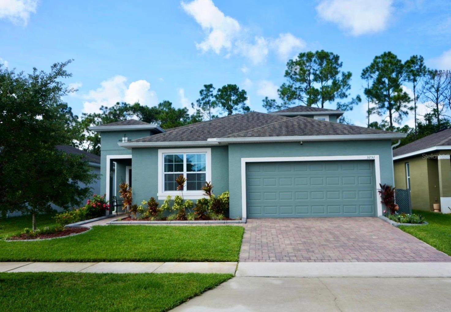 Enjoy privacy, comfort, and thoughtful upgrades in this beautiful home backing to a peaceful conservation area—no rear neighbors! Relax or entertain on the screened lanai with an added porch extension, offering year-round enjoyment of the natural surroundings. The property is beautifully landscaped with dedicated garden spaces and finished front garden edging for great curb appeal. Inside, a whole-home water filtration system provides fresh, clean water, while the insulated and fully finished garage features painted walls, built-in cabinetry, and a convenient utility tub—perfect for projects or extra storage. A versatile bonus room with its own private garage entry and built-in closet can serve as a 5th bedroom, private office, media room, or guest suite. With a blend of function, style, and privacy, this home is a must-see!