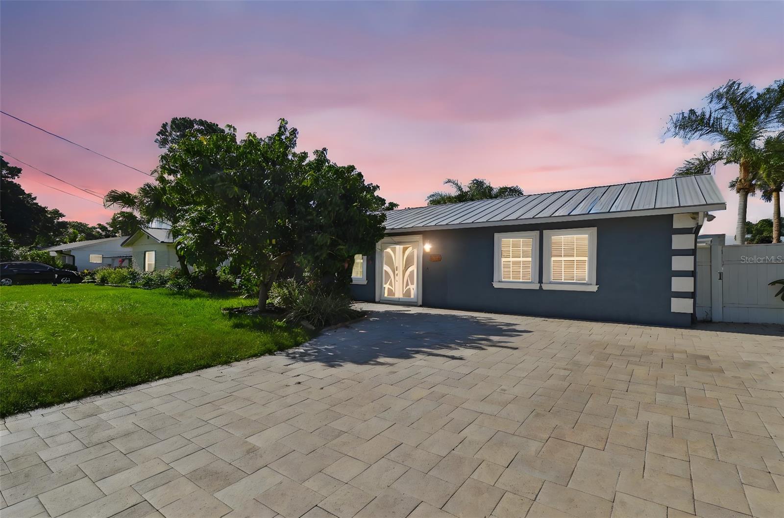 Nestled in the coveted Bay?Crest Park community, this classic 1963 ranch-style waterfront home at 8708 Thornwood Lane offers a rare blend of Florida charm and renovation-ready potential. Boasting 3 bedrooms, 2 full baths, and 2,073?sq?ft of open-concept living space on an 8,140?sq?ft lot, this property features coveted canal frontage with a seawall, covered boat lift, in-ground gunite pool and spa, and a metal roof replaced just three years ago—along with new HVAC, pool pump, and re-plumbing. Perfectly sited for boating to Tampa Bay or a sunset swim from your dock, the home retains travertine bathrooms and flexible living areas awaiting your personal finishing touches—but with the structural essentials already in place. HOA is optional and grants access to community boat ramp, holiday boat parades, and neighborhood social events—all just minutes from Tampa International Airport, downtown, and major expressways.