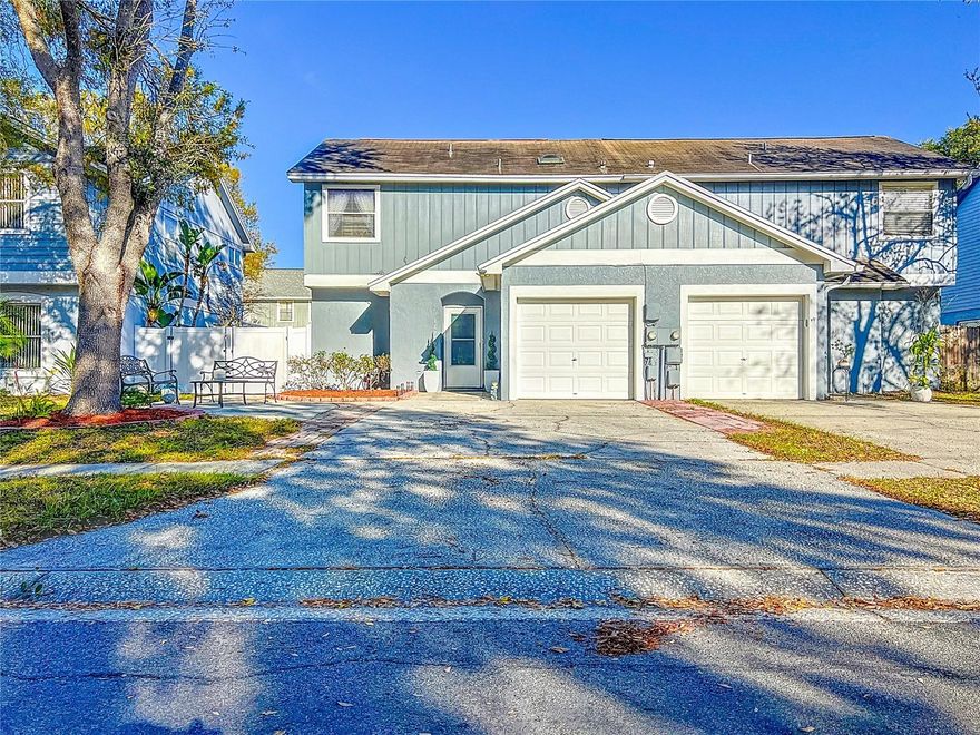 One or more photo(s) has been virtually staged. Back on Market with $10,000 Price Improvement!!   Buyer got "cold feet" before inspections were even done. Brand new plumbing just installed !!    Welcome to this beautifully renovated 2-bedroom, 2.5-bathroom townhome offering just shy of 1,400 square feet of thoughtfully designed living space in the heart of Northdale, just north of Carrollwood. Pride of ownership shines throughout, featuring a mix of laminate and tile flooring—no carpet anywhere—plus high-end finishes like stand-up showers in both bathrooms, a skylight in the primary bath, custom closet buildouts, and stylish updates from top to bottom.  

Enjoy added touches like recessed lighting, upgraded fixtures, a custom electric fireplace, and a built-in storage closet under the stairs. The kitchen boasts sleek granite countertops, adding a refined touch to the heart of the home.

Downstairs flows seamlessly into a fully screened-in lanai—perfect for relaxing or entertaining—which leads to a brick-paved backyard with low-maintenance turf. Out front, enjoy west-facing sunset views from your landscaped entryway, now enhanced with a cement walkway. The converted garage serves as a dedicated laundry area and bonus storage space, and the extended driveway fits up to four vehicles—rare for a townhome!

This home's location is as unique as it is convenient. Nestled among a mix of custom homes and larger estates, the area offers a semi-rural feel rarely found this close to the city—mature trees, room to breathe, and a refreshing departure from cookie-cutter communities.

Located in a top-rated school district—Steinbrenner High, Hill Middle, and Northwest Elementary—you’ll also enjoy a community pool, clubhouse, playground, and direct access to tranquil Le Clare Lake, featuring a dock, kayak storage, boat ramp, picnic shelter, BBQ grill, and open green space.

With a low quarterly HOA and easy access to the Veterans Expressway, Dale Mabry Hwy, Publix, St. Joseph’s Hospital, Sam’s Club, and Citrus Park Mall, this turnkey townhome is the perfect blend of comfort, charm, and location. Whether you're a first-time buyer or looking to downsize—this home is a standout opportunity.