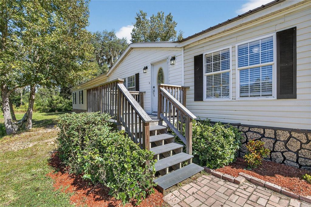 Photo of 11110 Walter Hunter Road, Lithia, FL 33547 (MLS # TB8446158)