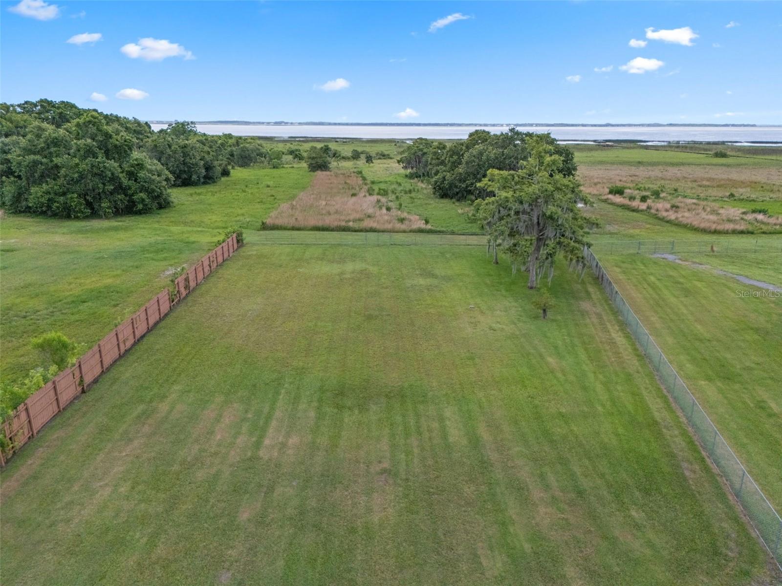 Pristine 1.16 acre homesite cleared and ready to build! Rare lakefront property on Lake Tohopekaliga where you can build your own private dock on state land behind the property. No HOA! Property next door is also available to combine parcels for a total of 2.32 acres. City water may be available, Zoned OAR1 for possible agriculture. Lake Toho covering 22,700 acres and spanning 42 miles in circumference. It's a popular destination for fishing, particularly for largemouth bass. Small shed/workshop currently located on property.