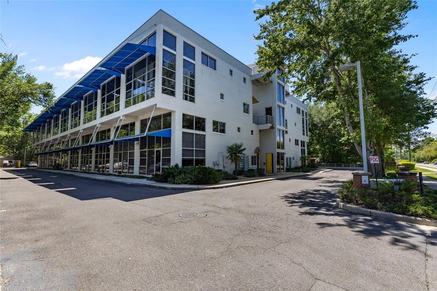 Loft Style Condo Close to UF & Shands! This 3 Bed/3.5 Bath concrete modern condo in second story includes Upgraded kitchen with granite countertops, a pantry, and a breakfast bar overlooking the living room and outside. The high ceilings, large commercial grade glass windows with beautiful green view , concrete floors throughout.an indoor washer & dryer closet, three open and spacious bedrooms each with its own private bathroom. Elevator in Building.Solid concrete block construction,multiple bus route to UF and Shands.