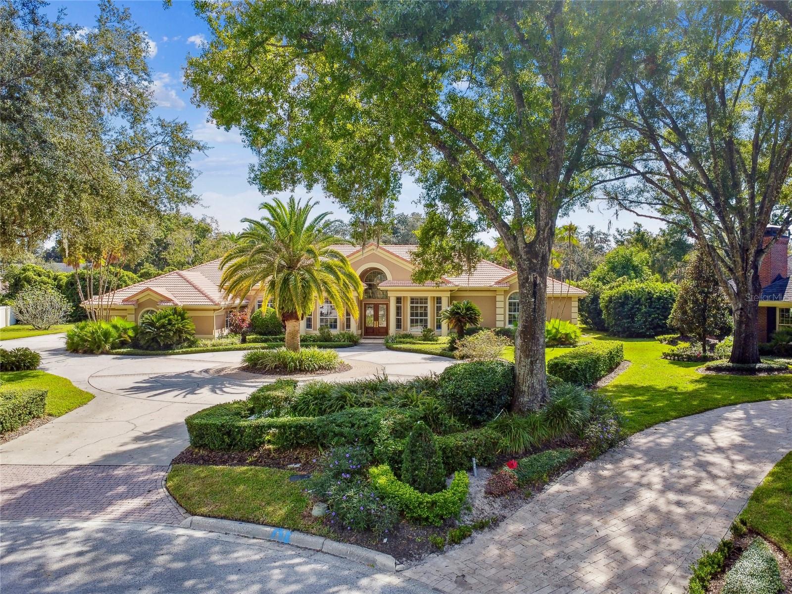 One or more photo(s) has been virtually staged. Step into this beautiful single-story residence located in Avila, a premier guard-gated golf and country club enclave in Tampa Bay. The setting for this home is nothing short of breathtaking. Nestled on a peaceful cul-de-sac and occupying nearly one acre, this property offers an exceptionally picturesque backdrop.
Upon your arrival, you'll be greeted by the meticulously manicured landscaping that gracefully accentuates the home's architectural style. Featuring 5 Bedrooms, 5 Bathrooms, Home Office, Bonus Room, Swimming Pool & Spa, and 5,152 square feet of air-conditioned living space, this residence is sure to captivate your heart and become your haven.
As you step through the double front entrance doors, you'll be welcomed into the stunning living room, which exudes elegance and charm. The open floor plan is thoughtfully designed to maximize space and functionality while allowing an abundance of natural light to fill the home through its numerous windows and French doors. The kitchen has undergone an extensive transformation, featuring custom cabinetry, quartz countertops, and professional-grade appliances. The island in the kitchen provides a welcoming space for seating, and the adjacent kitchen dining room creates an ideal setting to gather. The kitchen effortlessly connects to the adjoining family room, creating a seamless flow that enhances the joy of entertaining. The family room is adorned with a striking stone accent wall and elegant, rich wood floors. The owner's retreat serves as an idyllic private haven, featuring spacious his and her walk-in closets and a beautiful bathroom. From the owner's retreat, French doors open to reveal your screened-in swimming pool and spa, offering a tranquil escape. Within the residence, you'll find three ensuite bedrooms and two additional bedrooms that share a completely renovated Jack and Jill bathroom. The home boasts a fantastic bonus room, perfect for hosting gatherings and entertaining. It's the ultimate space for watching movies or playing a game of pool. Step outside to discover an extraordinary outdoor living area. The screened-in pool and spa create an ideal haven for basking in the Florida sunshine. Additionally, the ample covered patio space allows you to relish outdoor living, regardless of the weather.
The backyard is truly remarkable, offering a multitude of possibilities. You can consider building a guest house, crafting a private putting green, the possibilities are endless. Come home to Avila and enjoy the security, privacy and lifestyle that is the best in Tampa Bay!