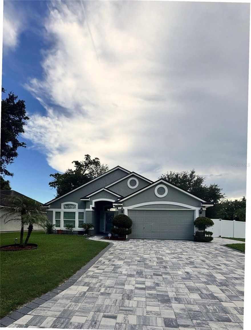 Welcome to this great modern home in the highly sought after community of Coachman Lakes. Elegant pavers driveway welcome you to this renovated 4 bedroom/ 2 bath split plan home that is fenced and offers vaulted ceilings, Living/Dining and Family Room, eat in Kitchen connecting to the Dining Room and a big island with seating area. Throughout the house you will find elegant and stylish laminate floors and tile in the bathrooms. The master retreat is very private and has a walk-in closet together with an ensuite bathroom with a stand up shower and a stylish Roman tub, updated fixtures and a nice size vanity with granite countertop. The A/C is brand new (2024). The Roof was replaced in 2024 with 25 years GAF shingles with Stain Guard Plus and Algae Protection. The home fenced backyard is covered with elegant pavers, has a nice size and can become your paradise and play area. This home is centrally located in Jacksonville, close to the Mayport Naval Station, the Mayo Clinic, the beaches and several shopping centers. Don't hesitate to show this impressive and  beautiful home in Coachman Lakes.  House is ready to move in!