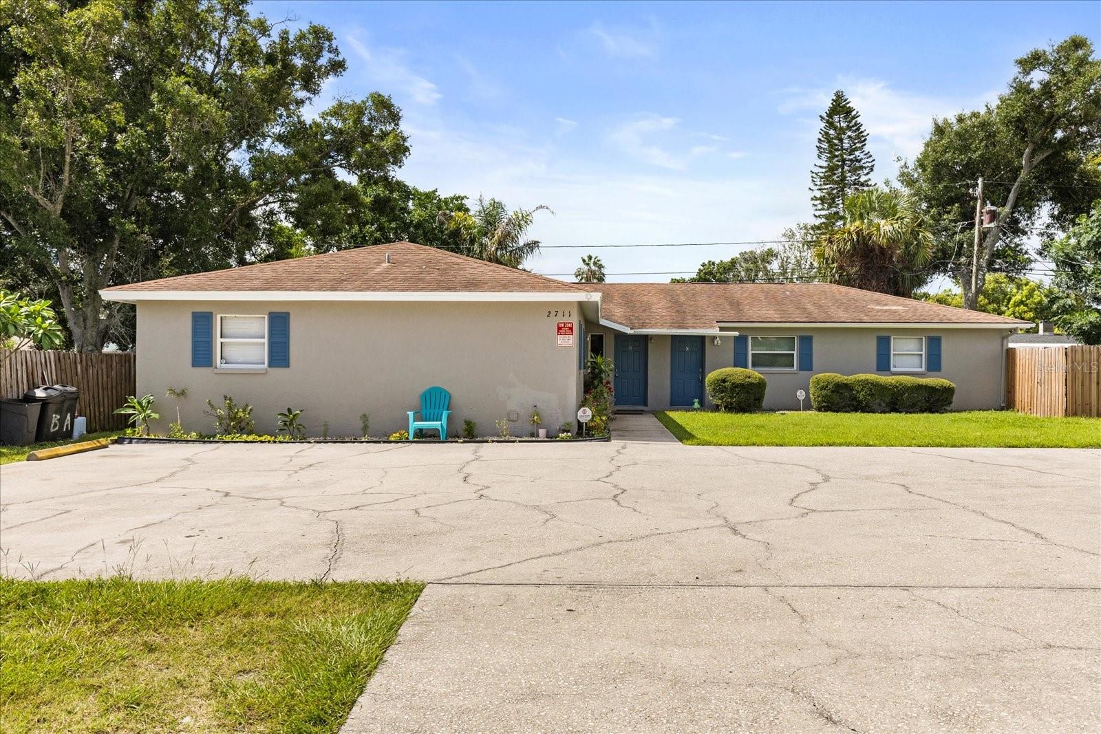Generous money-maker/ income-generating property in Clearwater, close to Safety Harbor. Cash-cow rental for investors, or owner-occupant if desired (with FHA loan should buyer occupy 1 unit for himself). Centrally located in Carlton Trace family neighborhood and close to major arteries US 19 and McMullen Booth. Beautiful, fully upgraded triplex has 2bed/1 bath - in all units with inside full-size washer/dryer laundry and hook up. Ceramic tile flooring throughout. Each unit pays their own electric and water on separate meters. Central heat and AC new (unit A & C) and Unit B (year 2015). New refrigerators (Unit B & C) and new washers and dryers (A&C). New granite countertops, all newly painted. Owner provides a garbage service since this is Pinellas County.This triplex has always been fully rented and produces great cash flow. Being Sold AS IS. Located in NO flood zone, NO HOA. Brand new roof replacement before closing. There are 2 parking spaces /unit. Backyard has been fenced in, designed with super cute patio with seating and nature's turf grass. Large front yard for privacy from quiet road frontage. Hurry, scoop this 'income' beauty which the owner gave much labor of love. Furniture is included! (Gross revenues: Unit A made $24k, Unit C $19k and Unit B $19200).