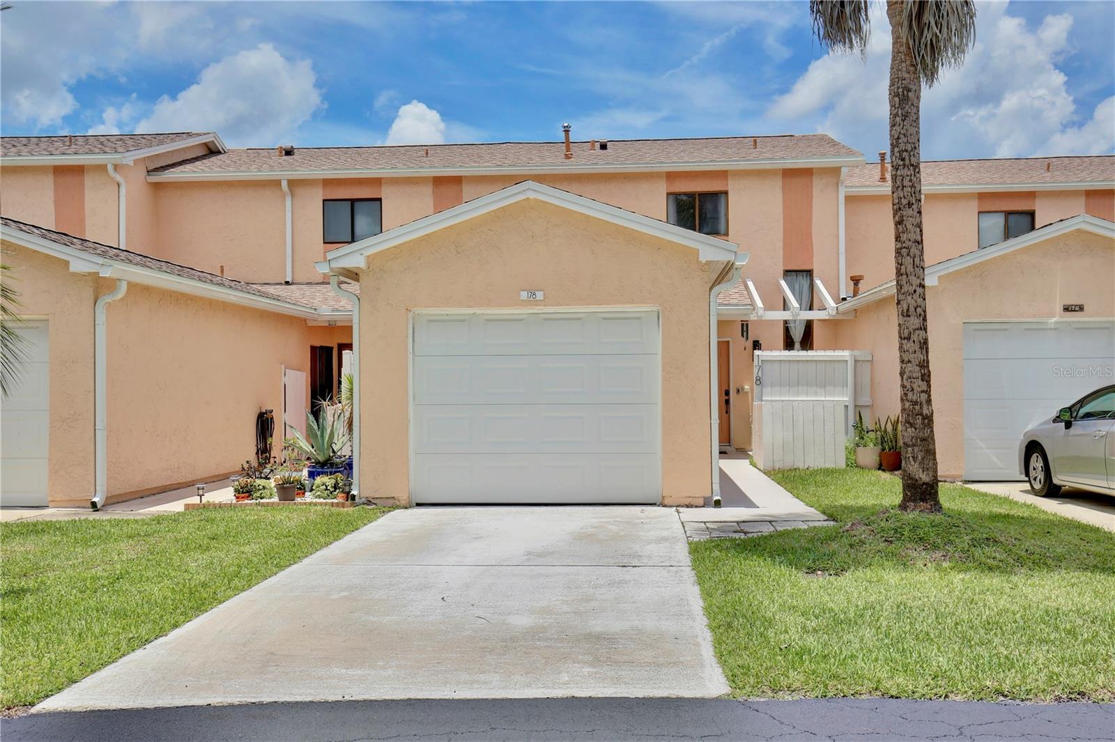 This move-in ready 2-bedroom, 1.5-bathroom condo offers 1,190 square feet of comfortable living space in Rockledge. The home features hard flooring throughout and ceiling fans for added comfort. The kitchen is well-equipped with a built-in gas range, pot filler faucet, built-in oven with warming drawer, wood cabinets, recessed lighting, and a convenient breakfast bar. The front patio includes a privacy fence for outdoor relaxation. Located in a gated community, residents enjoy access to a solar heated pool, riverfront volleyball court, tennis courts, and community dock with fishing pier and boat slips. Additional amenities include kayak storage with launch area, a clubhouse featuring a gym and kitchen, plus scenic walking trails. Conveniently positioned at the end of Viera Boulevard, this property is just minutes from shopping, dining, and quality schools. The location provides easy access to nearby Publix Super Market and Riverwalk Family Park & Nature Center.