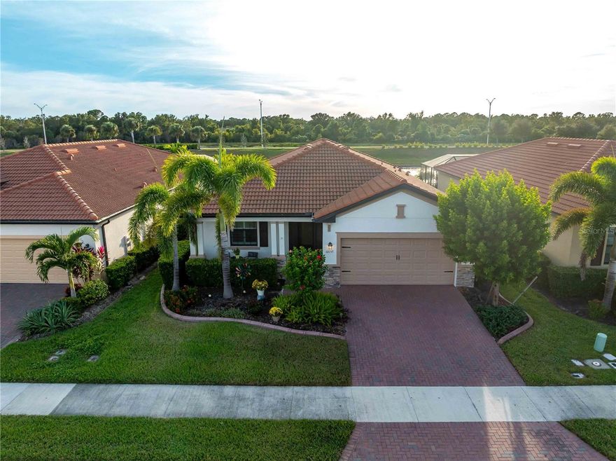 Welcome to 10157 Colubrina Drive, a FULLY FURNISHED home that beautifully captures the essence of Florida living. Located within the highly sought-after, gated community of Sarasota National, this 2020-built residence combines modern design, thoughtful details, and an inviting atmosphere that instantly makes you feel at home. From the moment you step inside, the open-concept layout creates a sense of space and ease. Tile flooring flows throughout the home, enhancing the light-filled living areas and giving the entire space a crisp, modern feel. The kitchen is perfectly positioned at the center of the home, offering abundant cabinetry, a clean and functional design, and a seamless connection to the dining and living spaces, making both everyday living and entertaining effortless. The primary suite feels like a private retreat tucked away from the main living areas, complete with a generous walk-in closet and a calming en-suite bathroom. Two additional bedrooms, each with built-in closets, provide comfortable accommodations for guests or the flexibility to create an office, fitness room, or hobby space that fits your lifestyle. The outdoor living area is where this home truly shines. A sparkling private pool and heated spa overlook a quiet pond, creating the perfect backdrop for peaceful mornings, relaxed afternoons, and stunning evening reflections on the water. Whether you are lounging on the patio, hosting friends, or enjoying a quiet moment to yourself, this space invites you to slow down and savor the beauty around you. Life in Sarasota National offers resort-style amenities and immaculately maintained surroundings, giving you a sense of luxury the moment you enter the gates. Beyond the community, you’ll find yourself just minutes from the charm of downtown Venice, where boutique shops, outdoor cafés, and coastal restaurants line the streets. The Gulf of Mexico’s most treasured beaches—including Venice Beach, Caspersen Beach, and Manasota Key—are all within a short drive, offering endless opportunities for sun-filled days, beach walks, and unforgettable sunsets. The area is also rich with golf courses, boating access, nature trails, parks, and everyday conveniences, making it easy to enjoy both relaxation and adventure.