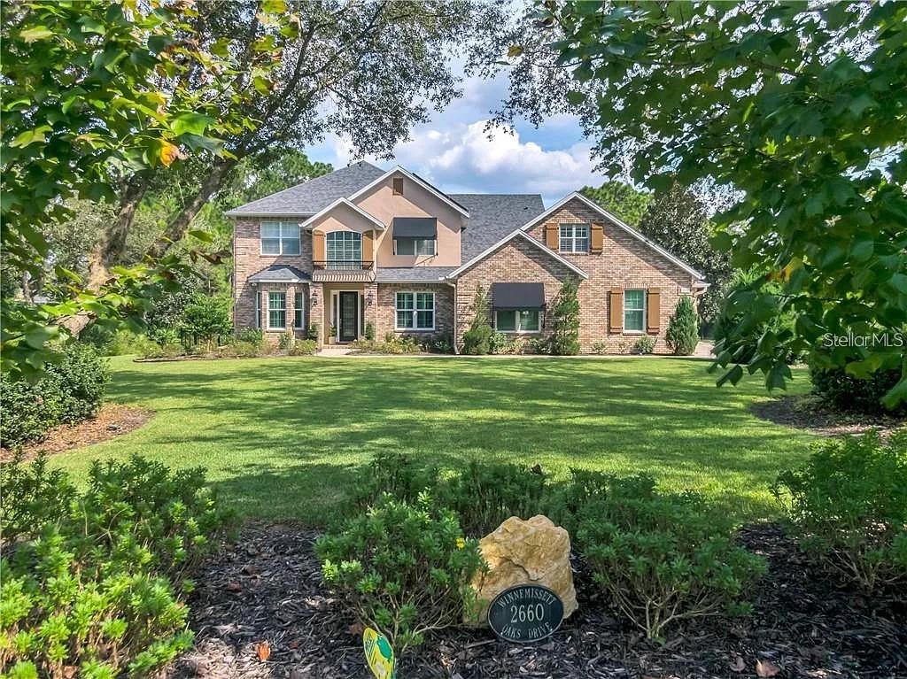 Welcome to 2660 Winnemissett Oaks Drive, an extraordinary custom estate in one of DeLand’s most exclusive communities. Located on a quiet, dead-end street in Winnemissett Oaks, this 6-bedroom, 5-bath executive pool home offers 4,814 sq. ft. of luxurious living space, a 3-car garage with over 1,100 sq. ft., and a long list of upgrades designed for comfort, performance, and lifestyle.Set on 2.5 meticulously landscaped acres, the home makes a striking first impression with mature landscape architecture, raised garden beds with irrigation, and a fully fenced backyard. Inside, soaring ceilings and a bright, open layout welcome you in. A formal dining room, spacious family room with gas fireplace and custom built-ins, and a chef’s kitchen flow seamlessly into one another, making everyday living and entertaining effortless.The kitchen is a true
centerpiece—featuring marble countertops, high-end appliances, soft-close custom cabinetry, and an ice machine. The primary suite on the main floor is a serene retreat with dual walk-in closets, a spa-style bathroom with double walk-in shower and soaking tub, and peaceful views of the pool area. A second flex suite with its own full bath offers the perfect space for a home office, guest quarters, or private study. Upstairs, you’ll find four additional bedrooms and three bonus rooms—ideal for a gym, media room, rec space, or creative studio.Outdoor living is truly elevated with a screen-enclosed pool and spa, surrounded by a double-height pool cage, recently resurfaced deck (July 2025), and a gas-heated hot tub—perfect for relaxing evenings or entertaining guests.This home is as efficient as it is beautiful. A solar panel system generating approximately 24 megawatt-hours per year keeps energy costs down while supporting sustainable living. Additional features include a whole-home water filtration system, water softener, electric vehicle charging station, and coastal storm shutters for peace of mind.The oversized 3-car garage offers plenty of room for vehicles, toys, and projects, complete with a lighted workbench and custom tool storage. Located just minutes from I-4 and downtown DeLand, this property is tucked into a private neighborhood with a low HOA of just $1,100/year. With a perfect balance of style, space, and smart living, 2660 Winnemissett Oaks Drive is more than a home—it’s a lifestyle opportunity. Come see what makes this custom estate truly one of a kind. **MLS Info is intended to be correct but is not guaranteed and all information must be verified by buyers.**