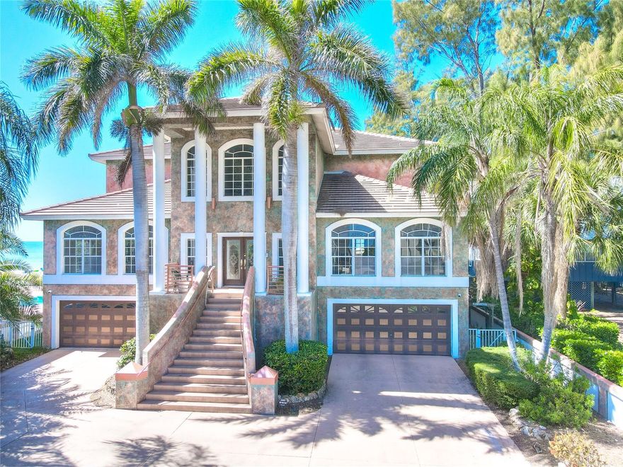 Panoramic Gulf Estate with 5500 heated sq feet on 4 lots totaling 80x200.Split garages for 6 cars. Beautifully landscaped architecture with several Royal Palms. Winding sidewalk through lush greenery and a in ground lagoon spa with waterfall.Bucolic pathway through sea grapes to the beach. 60 ft upper and lower balconies to view the spectacular sunsets. This location provides great privacy as it is not near a beach access. The property also includes a 1080 sq ft 3 bedroom 3 bath guest house that can and has been used as a vacation rental.There are no restrictions. Gross rent was 84K in 2022.