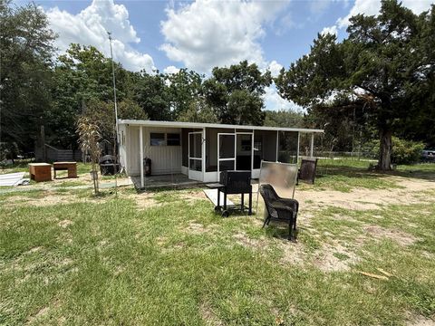 Photo of 10360 SE 131st Lane, Ocklawaha, FL 32179 (MLS # OM725829)