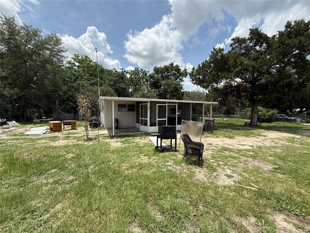 Photo of 10360 SE 131st Lane, Ocklawaha, FL 32179 (MLS # OM725829)