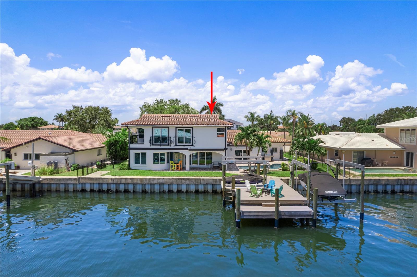 Located in one of Tampa Bay's most premier boating communities with close proximity to highly rated schools. Come experience one the finest residences in Venetian Isles. Easy, no bridge, direct water access to Tampa Bay in seconds. Incredible floor plan with spacious open kitchen, large living room, plus a bonus flex space that can be used as a playroom, den, or office. Double primary options. Original primary is downstairs with beautiful waterviews and en-suite updated bathroom and walk-in closet. Upstairs primary option also features en-suite bathroom and walk-in closet with bonus of a private balcony and views of the Sunshine Skyway. The home was designed with entertaining in mind. Centrally located kitchen. Entire rear of the home opens up to the water and spacious patio/pool area. Seawall has been replaced, newer custom dock, 13k lb boat lift, new 6k jet ski lift. Recent renovations include the 3rd garage bay extending the entire climate controlled garage to accommodate multiple car lifts if desired. BRAND NEW KITCHEN AND UPSTAIRS PRIMARY. Another addition to the home is the new utility room and a half bathroom that also serves as a pool bath. New main house HVAC Condenser and Air Handler Bosch SEER 20 (Ashmore Air). Come watch the dolphin play in your backyard daily or relax in your heated swimming pool and spa. Fenced in yard with optional dog run. Quick cruise in your golf cart to vibrant downtown St. Petersburg. Easy commute to Tampa International Airport. Less than 25 min to our World famous Beaches. Come see why life in Venetian Isles is so desirable. All room sizes are approximate. isles Homeowners Association is optional. Deed restrictions are mandatory.