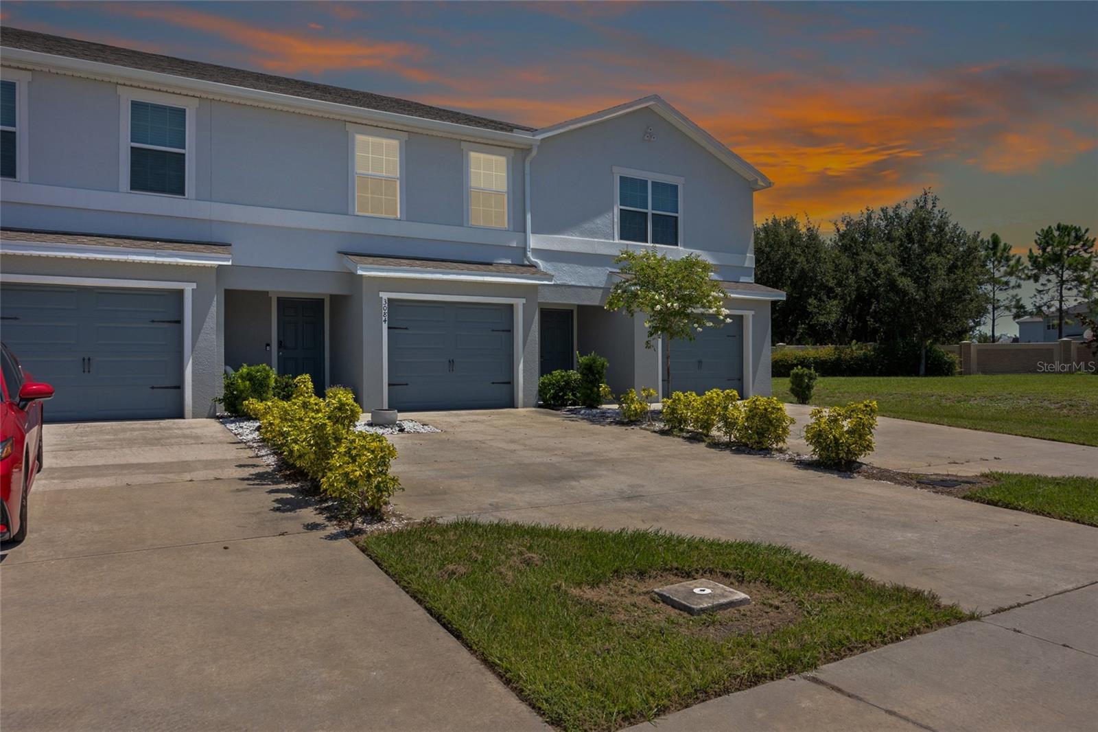 Discover comfort and convenience in the heart of Gramercy Farms! This beautifully maintained townhome, built in 2021, offers modern living with thoughtful updates throughout. Move-in ready and featuring an attached garage plus an Extended Driveway, you'll enjoy both style and functionality from the moment you arrive. Step inside to an open-concept main floor, where the spacious living area boasts sleek Luxury Vinyl Plank flooring that flows into a bright and airy kitchen. Complete with Stainless Steel Appliances, Granite Countertops, an Extended Breakfast Bar, and Pantry - this kitchen is perfect for casual dining and entertaining. The adjacent laundry area, convenient half-bath, and extra storage—including a cleverly designed under-stair closet—make everyday living easy. Step out onto your Screened-in Lanai with an attached exterior storage closet and enjoy the privacy of having no rear neighbors. (Fencing is permitted for added seclusion or a pet-friendly backyard.) Upstairs, you'll find the spacious Primary Suite featuring a large Walk-in closet, extra Linen storage, and a beautifully finished en-suite with Dual sinks and a fully tiled walk-in shower. Two secondary bedrooms share a full bath and hallway linen closet—ideal for family or guests.
Located just minutes from the Turnpike and only 20 minutes to Lake Nona, this home offers easy access to local shopping, dining, and entertainment. Parks, schools, and grocery stores are all close by, making this townhome the perfect blend of comfort and connectivity!
Don’t miss your opportunity to call Gramercy Farms home—schedule your private tour today!