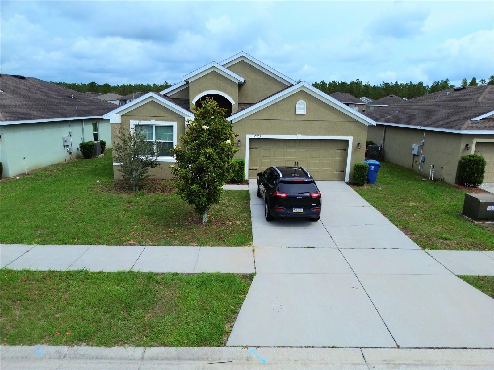 Welcome to your next home in beautiful Brooksville! This spacious 4-bedroom, 2-bathroom single-family residence is perfectly situated on a serene golf course, offering stunning views and peaceful surroundings. As you enter, you're greeted by a versatile bonus room – ideal for a formal dining area, home office, or a fun playroom for the kids. To the right, you'll find a large master suite complete with a walk-in closet, en suite bathroom featuring a walk-in shower, and a massive soaking tub. The heart of the home boasts an open-concept kitchen with granite countertops, stainless steel appliances, and a spacious layout that flows effortlessly into the living room. The living area is filled with natural light and features a sliding glass door that opens up to a covered patio, perfect for relaxing while enjoying the lush golf course views. Down the hallway, you'll find three additional nicely-sized bedrooms and a well-appointed main bathroom. Available starting July 15th, this home combines comfort, style, and a premium location. Don’t miss the opportunity to live in a golf course community with all the space and amenities you need!