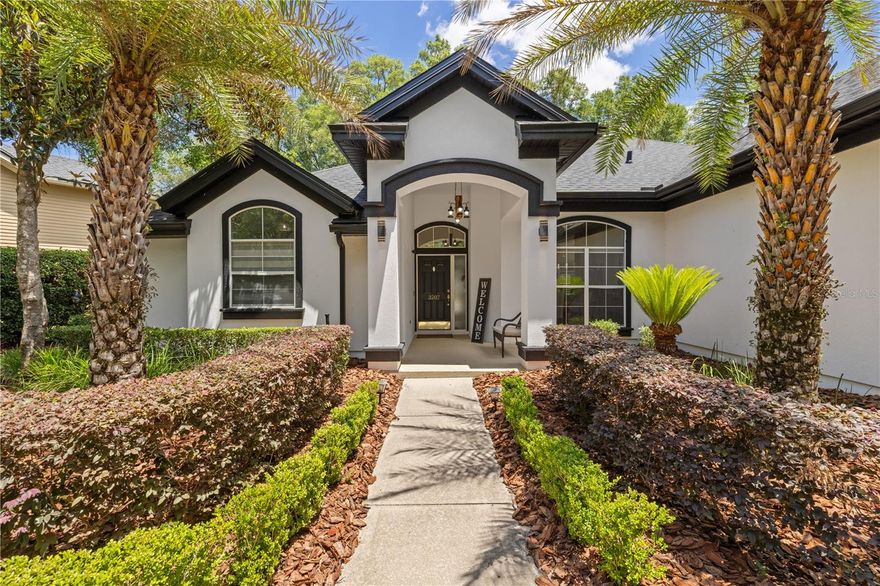 Experience Florida living at its finest in this gorgeous pool home located on sought-after Katelyn Lane in award-winning Haile Plantation built by Tommy Waters. Ideally positioned just a half mile from Hawkstone Country Club, blocks from Hampstead Park, a golf-cart ride to Publix, and surrounded by 26 miles of scenic trails, this home offers the lifestyle buyers dream about. Designed with an ideal bright and open floor plan, this 4-bedroom, 3-bath home features a desirable three-way split layout, including a private bonus room with its own full bath — perfect for guests, a home office, gym, or media retreat. The beautifully renovated kitchen is the heart of the home, showcasing ceiling-height cabinetry, Quartz countertops, farmhouse sink, stainless steel appliances, and seamless flow into the spacious great room with fireplace and magnificent views of the sparkling pool and outdoor living spaces. A sunny breakfast nook with a wall of windows, soaring ceilings, and formal dining room create a warm yet elegant atmosphere throughout. The owner’s suite feels like a peaceful retreat with two walk-in closets and a beautifully updated spa-inspired bath. Two additional guest bedrooms and bath are privately situated on the opposite side of the home. Step outside and discover an entertainer’s paradise featuring an expansive paver lanai, pool and spa, fenced backyard, and a stunning Argentine grilling pit with custom firebrick hardscape — designed for unforgettable gatherings and relaxed Florida evenings. Additional highlights include an oversized garage, elegant landscaping, fresh interior paint, 2022 roof, 2021 HVAC, and 2023 water heater — truly move-in ready. Located near UF, Shands, VA, Santa Fe College, I-75, Butler Plaza, and Celebration Pointe, and zoned for Chiles, Kanapaha, and Buchholz schools, with access to many outstanding private schools nearby. Residents of Haile Plantation enjoy a vibrant lifestyle with Saturday farmers markets, charming village shops and restaurants, parks, golf course views, and miles of walking and biking trails woven throughout the community. Optional membership to Hawkstone Country Club offers a Gary Player-designed golf course, driving range, two pools, fitness center, exceptional dining, and eight pickleball courts, including two lighted courts. This is more than a home — it is a lifestyle. Schedule your private tour today.