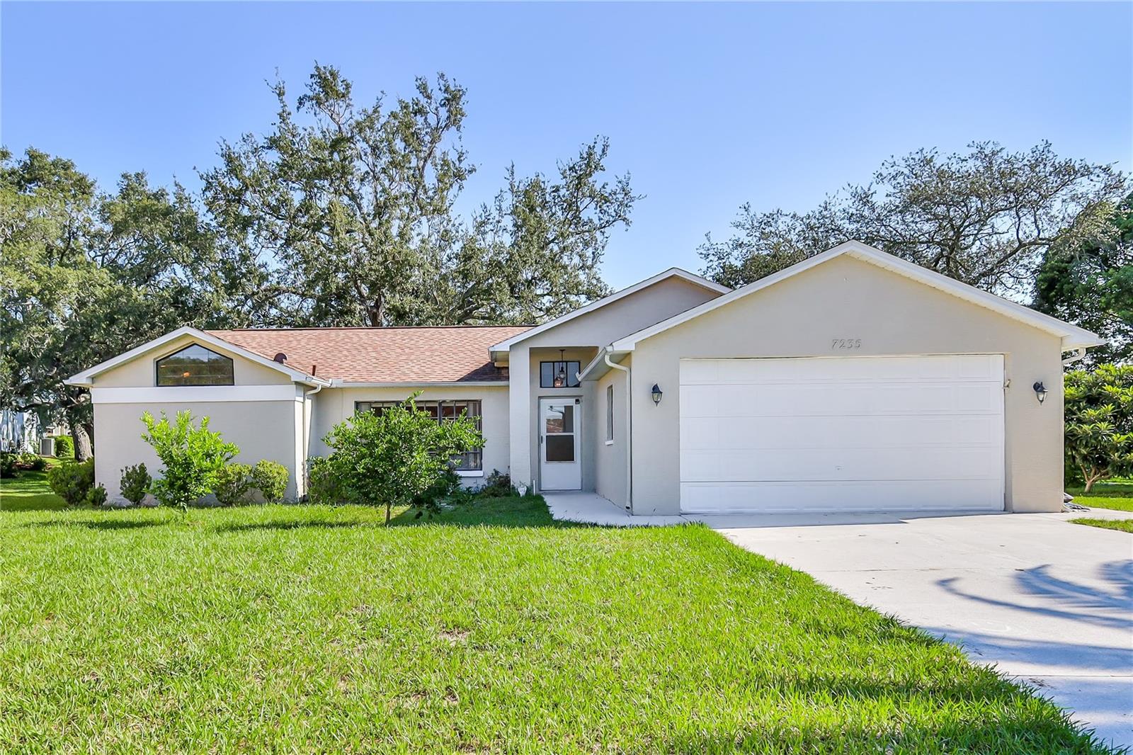 Welcome to this charming home in the desirable Regency Oaks community, perfectly situated on a quiet cul-de-sac! This 2-bedroom, 2-bathroom, 2-car garage property sits on a spacious quarter-acre lot and offers both comfort and functionality with its thoughtful split floor plan.
Step inside to find a bright main living area with vaulted ceilings, laminate flooring, and sliding glass doors that lead to the screened and covered lanai—ideal for relaxing or entertaining. The partially fenced backyard also features an open patio, perfect for enjoying the Florida sunshine.
The kitchen boasts vaulted ceilings, stainless steel appliances, a breakfast bar, pantry, and a cozy dining nook with plenty of natural light. The primary suite includes sliding doors to the patio, two closets, and a large ensuite bathroom with a shower, tub, linen closet, and vanity. A spacious second bedroom with two closets and a ceiling fan is located on the opposite side of the home, along with a full hall bath.
Additional highlights include two large storage closets, an inside laundry room with a utility sink, a newer roof (2019), and HVAC (2019) for peace of mind.
This property combines a great layout with desirable updates in a sought-after location—ready for you to call home!