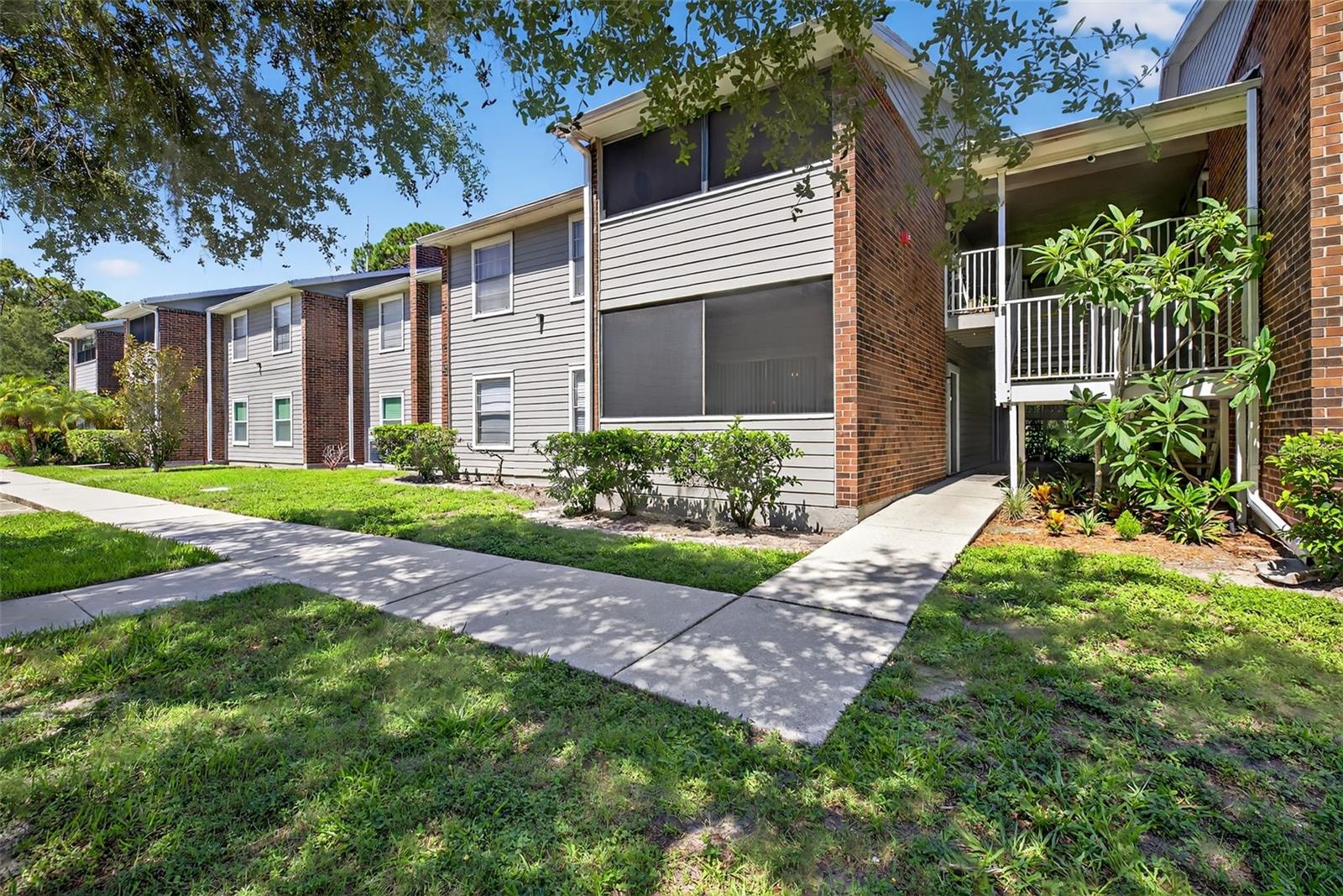 Affordability and convenience combine to give you this rare opportunity. The large condo is light and bright and has recently been refreshed and updated. The large kitchen features plenty of storage, new SS appliances, epoxy counter tops by a local artist, and so much more. The living area is large, has access to private patio, and opens to the dining room just off the kitchen. The primary bedroom has ample space, with a large walk-in closet and en-suite bathroom that has new flooring, vanity, lighting and fixtures. The 2 secondary bedrooms offer generous space with lots of natural light. Combine all of this with inside laundry, with a newer washer/dryer that will stay, and you can see why this condo offering should not be missed. The community has assigned parking, plenty of visitor spots, beautiful pool, spa, gym, outdoor grills, sports courts, and some of the lowest fees in St Pete for the condos size! This ideal location is very close to Gandy, I275, US19, Downtown St Pete, the Tampa area, both airports, shopping, dining and so much more. These larger condos rarely come available. It's priced to go quick so come see for yourself and make your appointment for a private showing! Condo comes unfurnished