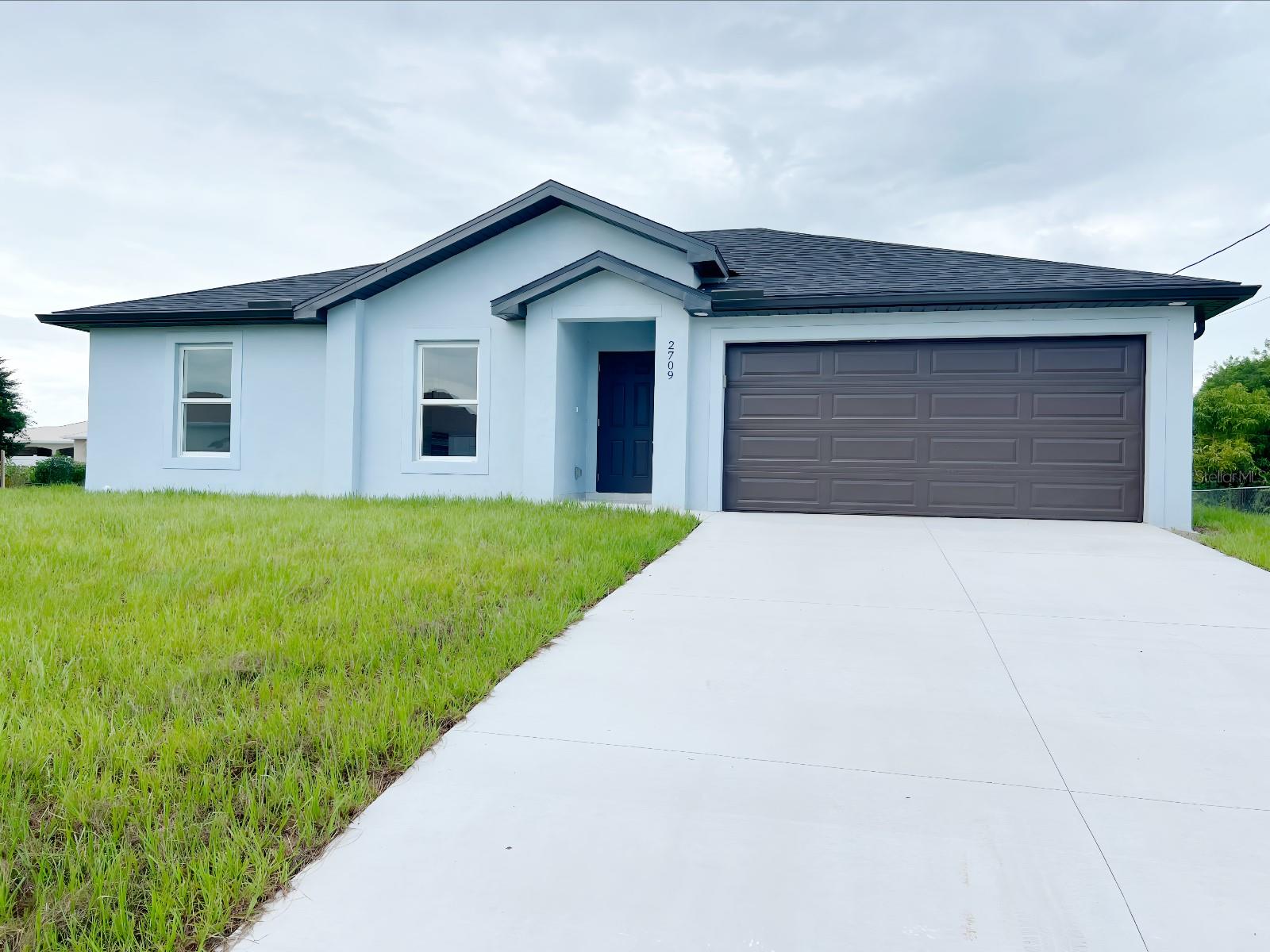 NEW CONSTRUCTION. Nestled in a growing neighborhood just minutes from shopping, fuel stations, family entertainment, beaches and
Fort Myers, this modern single-story home offers a bright, open layout with three generously sized bedrooms and two full
bathrooms. The interiors are elegantly finished with stone (quartz) countertops and stylish tile flooring that flows seamlessly
throughout. Built with quality block-and-stucco construction, it features an attached two-car garage and sits on a spacious lot
with room to enjoy the outdoor space. With its sleek, move-in-ready appeal and convenient location near everyday amenities
and major roadways, this home delivers both practicality and polished modern living.