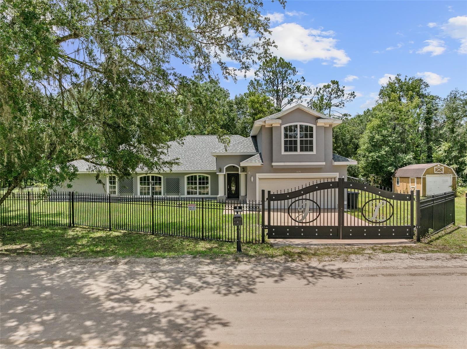 Welcome to your dream retreat in Bunnell—where peaceful country living meets the convenience of city access. Located just outside the city limits, this stunning property offers the best of both worlds. Sitting on a fully fenced acre, you’ll enjoy the privacy and freedom of open space while still being minutes from restaurants, shopping, and schools. Per the city, the road is also scheduled to be paved in the near future, adding even more value and ease of access.
This beautifully maintained home boasts nearly 3,500 square feet of living space, featuring 5 spacious bedrooms and 3 full bathrooms. A rare feature of this home is that it offers two primary bedrooms, perfect for multigenerational living, guest accommodations, or even rental flexibility. The thoughtfully designed split floor plan ensures comfort and privacy for all.
At the heart of the home is a generous open-concept living area, ideal for entertaining and everyday life. The kitchen is equipped with ample cabinetry, a center cooking island with a built in sink, and views into the living and dining areas, creating a seamless flow for gatherings and conversation. Natural light floods the interior, highlighting the quality finishes and inviting atmosphere.
A versatile flex room offers endless possibilities—transform it into a home office, gym, playroom, or even an in-law suite. With five true bedrooms plus this bonus space, there’s room for everyone and everything. Whether you’re working remotely or hosting guests, this layout easily adapts to your lifestyle.
Step outside to enjoy the tranquility of your one-acre property, fully fenced for privacy and security. There’s plenty of room to build a pool, start a garden, or just enjoy the wide-open space and fresh country air. Homes like this—so close to town yet tucked away in a peaceful setting—rarely come to market. Don’t miss your chance to call this Bunnell beauty home!