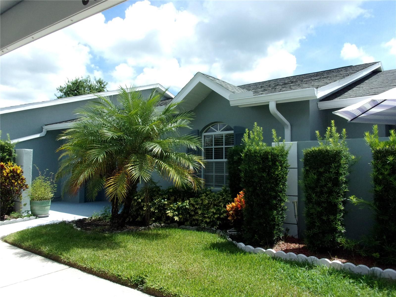 Discover easy living in the heart of Zephyrhills FL.!! Welcome to this inviting 2 bedroom. 2 bathroom villa nestled in the desirable 55+, gated Driftwood Homeowners Community. With it's updated kitchen featuring stylish cabinets, stainless steel appliances, and a spacious open concept living and dining area. This home is perfect for those who love to entertain or simply relax in style. Step into the Florida room, a cozy extension of the living space, complete with heating, cooling, and a convenient laundry closet. The master bedroom can easily accommodate a king size bed with 2 dressers. The master suite is a retreat in itself, boasting a walk in closet, a full walk in shower and a gorgeous newly installed vanity. The second large bedroom can comfortably fit a queen sized set, offering both space and privacy or a large office space with a sofa bed. Guests will feel right at home with their own bathroom, complete with two linen closets and a new vanity. Both bathrooms have new toilets. Enjoy maintenance free living, ideal for a seasonal retreat or as a full time residence for those looking to escape cold winters. With a new HVAC installed in 2021, peace of mind comes standard. No storm damage and no flooding issues here! In addition to this delightful villa, a well appointed community center and a large, perfectly maintained swimming pool are added amenities. Don't miss out on this beautiful, move in ready villa. Schedule your showing today and make this gem your new home in paradise!!