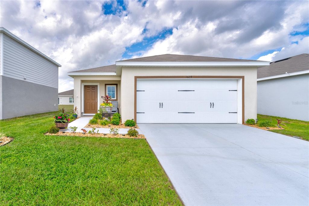 Photo of 1609 Finnigan Circle, Haines City, FL 33844 (MLS # O6396022)