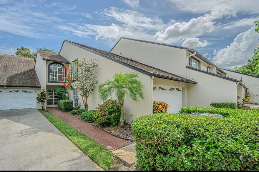 Welcome home to 4228 Arborwood Lane, a beautifully remodeled townhome tucked away in the highly sought-after Carrollwood Village community. This spacious 3-bedroom, 2.5-bath residence offers a rare blend of modern updates, classic charm, and serene pond and golf course views, all in one of Tampa’s most desirable locations. Step through the gated courtyard and into a warm and inviting interior featuring hardwood and tile flooring, plantation shutters, and abundant natural light throughout. The spacious living room centers around a two-way wood-burning fireplace, seamlessly connecting to a cozy den or dining area. Oversized sliding glass doors lead to a screened lanai, the perfect spot to unwind and enjoy tranquil water and golf course vistas. The updated kitchen is equipped with granite countertops, modern appliances, custom cabinetry with pull-outs, and ample counter space—ideal for everyday living and entertaining alike. Upstairs, retreat to the expansive primary suite, featuring a private screened balcony, walk-in closet, and updated ensuite bathroom. Two additional bedrooms offer plenty of space for guests, a home office, or hobbies. Enjoy a low-maintenance lifestyle with a monthly fee that covers roof, exterior maintenance, water/sewer, cable, internet, and community amenities. Residents of Fairway Lakes Phase 1 have exclusive access to a private community pool, while the Carrollwood Country Club—just a short stroll away—offers optional social, tennis, and golf memberships. This prime location places you minutes from Carrollwood Village Park, the Cultural Center, top-rated dining, shopping, Publix, and easy access to Tampa International Airport, downtown Tampa, and the beaches. Don’t miss this rare opportunity to own a home that perfectly blends location, lifestyle, and comfort in the heart of Carrollwood Village.