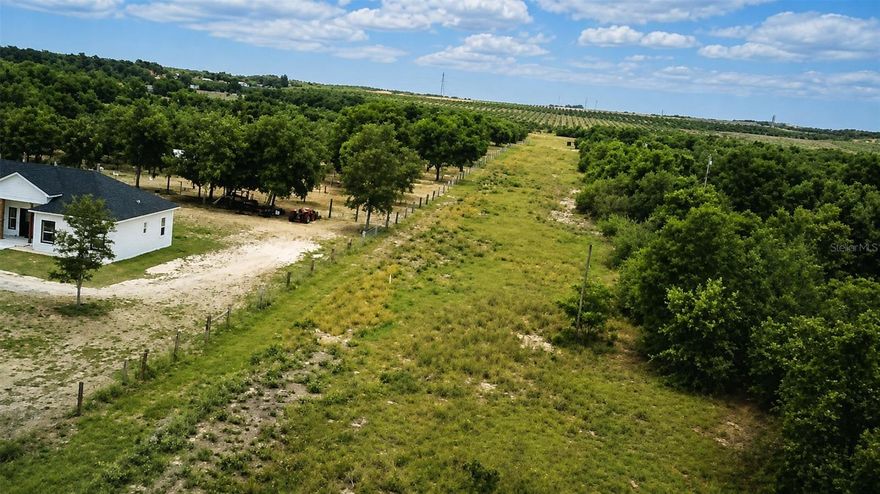 Are you searching for the perfect piece of Florida countryside with PRIVACY, freedom, and ENDLESS POSSIBILITIES? Welcome home to this beautiful 4.98-acre property in PEACEFUL Lake Wales. Mostly cleared and ready for its new owner, this rare property is ideal for building your dream home, placing a mobile or modular home, and enjoying a quiet country retreat.

Surrounded by scenic rural beauty with orange grove views across the street, this property offers the charm of country living while still being conveniently located near shopping, dining, schools, and major roadways. NO HOA giving you the flexibility to truly make the property your own. Bring your horses, chickens, RVs, boats, and outdoor toys — there’s PLENTY OF ROOM to spread out and ENJOY the FLORIDA LIFESTYLE.

The large cleared area helps save time and expense for future development, while the peaceful setting creates the perfect escape from busy city life. Located near popular attractions such as Bok Tower Gardens, Lake Pierce, boating, fishing, and hiking trails, this property offers both tranquility and convenience. Opportunities like this are becoming harder to find in growing Polk County. Don’t miss your chance to own your own slice of Florida paradise. Buyer and buyer's agent to independently verify all info provided and zoning allowance.