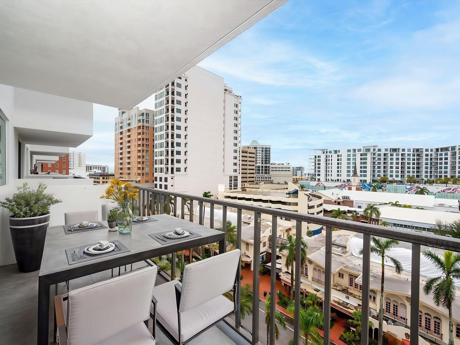 One or more photo(s) has been virtually staged. Renovated Two-Bedroom in Downtown Sarasota! After a total transformation and update to meet improved building and hurricane regulations, The 101 Condominiums emerged as an outstanding choice in Downtown Sarasota. This fantastic location offers unmatched convenience for everything you need. You know you have found something special from the moment you set foot in the area. A bright and inviting lobby sets the tone for the exceptional quality found throughout the building. The updates in this residence are impressive and make a similar statement. It provides lovely city views of South Palm Ave during the day and sparkling city lights at night from its 10th-floor location. The two-bedroom, two-bath floor plan includes a private covered balcony, hurricane windows, and doors for added peace of mind. The modern kitchen boasts granite countertops, high-quality cabinetry with built-in pantry storage, and recessed lighting. The customary package of stainless-steel appliances remains. The breakfast bar overlooks a spacious great room with areas for both living and dining. Lovely luxury vinyl plank flooring can be found in most rooms. The primary suite has a walk-in closet and an updated personal bathroom. The guest quarters have another upgraded bathroom and a secondary bedroom, complete with a convenient laundry closet with a Bosch washer/dryer. There is attached garage parking for one car, though you might find it unnecessary as everything you need is a short distance. The newer A/C system and water heater are bonuses. Building amenities include a heated swimming pool, a sun patio, a fully equipped fitness center, a mailroom, a club kitchen with social spaces, and a studio room for dance, yoga, and other fitness activities. Across from Sarasota Bay, the city marina and waterfront park, it is in the heart of a vibrant area filled with excellent restaurants, shops, and art galleries. The Opera House is just around the corner, and the Cinema Arts Theater is down the street. It is only five minutes from the chic St. Armand's Circle and the scenic Lido Beach. Consider yourself truly fortunate to have discovered this wonderful residence. Please note the furniture is negotiable if interested.