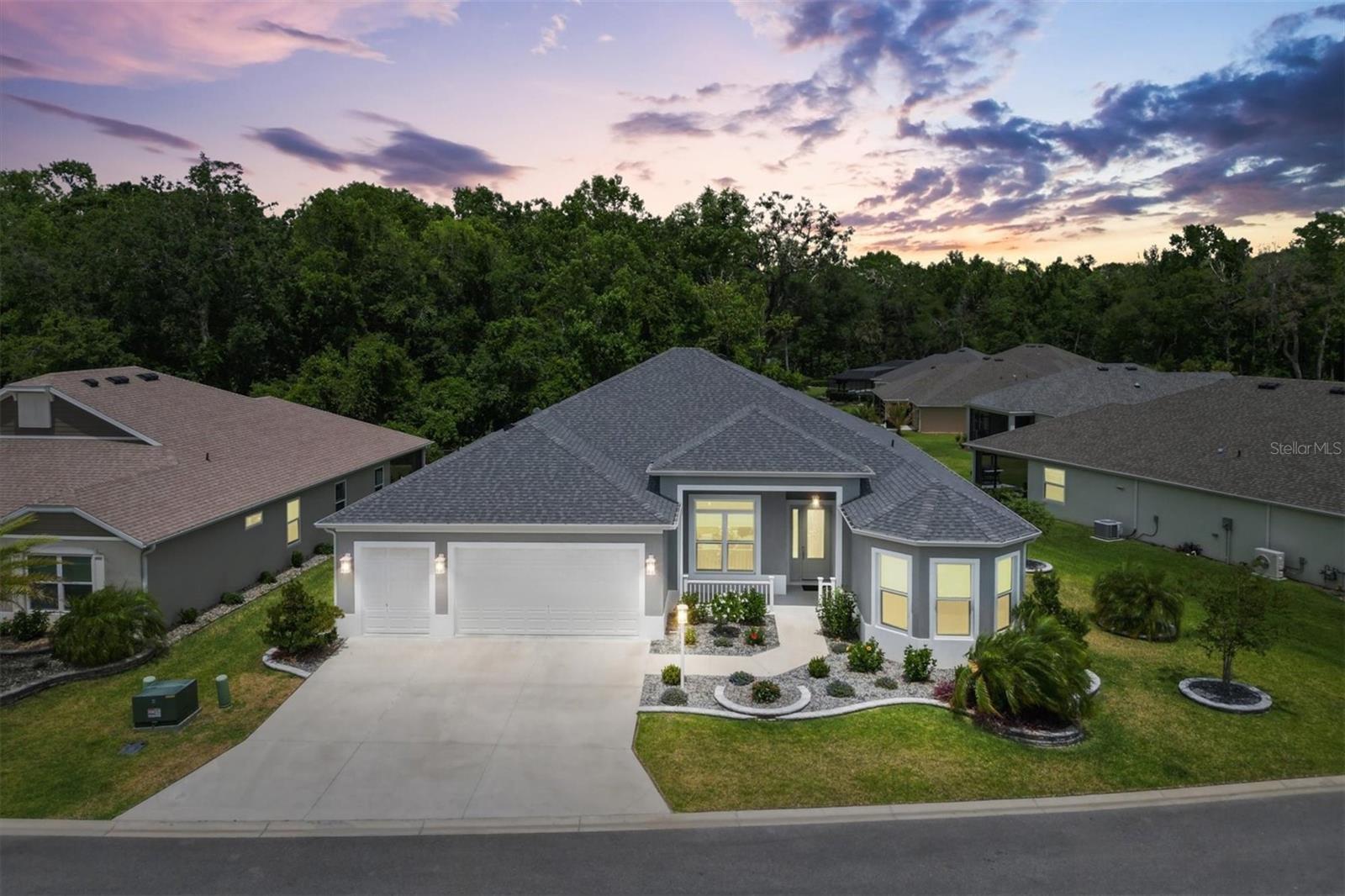 Welcome to your dream home in The Village of Lake Denham in The Villages! Where the BOND IS PAID OFF. This stunning Premier Stretched Sanderling Floor Plan offers 4-bedrooms, 3-bathrooms residence with a lavish 2,338 square feet of living space, Expanded 2 Car plus a Golf Cart Garage, a saltwater Pool in an extra-large lanai, neatly wrapped in elegance and comfort. Situated on a preserve-viewed lot, privacy and picturesque scenes are a certainty, not just an amenity. Step inside and feel the luxury underfoot. The spacious open-plan layout is accented by crown molding and wainscoting, adding a touch of sophistication to your daily living. For those who revel in culinary adventure, the outdoor kitchen provides the perfect stage for your sunset barbecues or serene morning coffees in the large, screened-in lanai. Unwind in style in the primary bedroom, a sanctuary designed with relaxation in mind. Each additional bedroom offers its unique charm, ensuring that every family member or guest finds a cozy corner to call their own. Nature lovers and recreational enthusiasts will appreciate the proximity to Franklin and Dabney Recreation Center as well as the Eastport Town Square, just a hop, skip, and a jump away for your leisure activities. Shopping and dining experiences await at Brownwood Paddock Square, ensuring your days can always have a little extra sparkle. And there’s more than just beauty; functionality is key in this house equipped with an air purification system ensuring that you breathe easy year-round. The thoughtfully updated landscaping means low maintenance, so more time can be spent enjoying your new home, not just maintaining it. This home is a blend of comfort, class, and convenience with a paid off bond. What does a Paid Off Bond mean for you on this home it is a savings of $3,280. a year off your tax bill that would need to be paid until 2053. So, why wait for a New Home when this one is like new loaded with Extras and ready to Move into Today. Could this be the perfect match? Your new beginning awaits in The Villages!