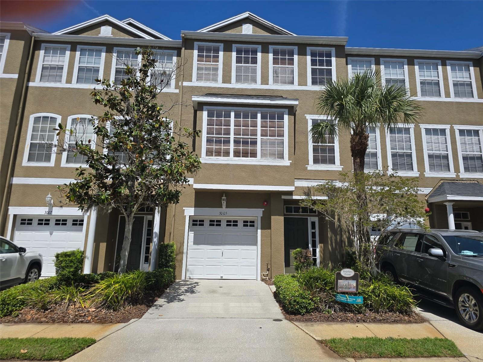 MOVE IN READY...MINUTES FROM MACDILL AFB....3005 Bayshore Pointe Dr is a townhouse located in beautiful bayshore pointe community Built in 2001, this 3-bedroom, 2 full and 2 half bathroom home offers approximately 1,926 square feet of living space. Did I mention this is the largest floorplan in the community. The property features a one-car garage. The community is a gated neighborhood comprising 150 homes and is conveniently located just off Bayshore Boulevard, approximately half a mile from MacDill Air Force Base. Residents benefit from proximity to Tampa's waterfront and enjoy amenities such as a community pool, spa, pickelball/tennis courts. Private fishing pier on the bay. This home is loaded with upgrades. Upgraded flooring throughout, fresh paint, stainless appliances, tankless water heater, water softener and some of the best amenties in south tampa. Don't miss out on this beauty.