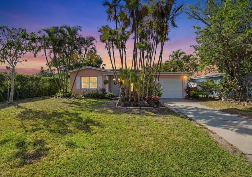 WATERFRONT! Welcome to 6650 Hibiscus Ave. South - a Mid Century waterfront home located in sought-after South Pasadena. This home offers a rare opportunity to enjoy a tranquil natural environment without sacrificing convenience, could be a great short-term vacation rental located on boatable water. Just minutes from the 'Old Florida' charm of Gulfport, the beautiful sands of Treasure Island and St. Pete Beach, great restaurants, shopping, galleries, vibrant downtown St. Pete, and 2 International Airports - it's the perfect balance for today's Florida living. This concrete block home features a generous split floor plan with 3 bedrooms and 2 full bathrooms (hall bath and primary en-suite bath). There's lots of storage in this home - plus a large bonus room / office area with water views, an attached utility / storage room, a designated laundry room with washer & dryer hookups, and a large 1-car garage with a 9 ft. wide door and automatic opener. Enjoy a low-maintenance tropical landscape with established mature palms and shrubs. Updates include a new roof in 2016, solar panels in 2020, A/C system in 2023, and water heater in 2024. This is truly a unique opportunity to live on the water in this amazing area - your waterfront gateway to fun and adventure, with plenty of room on your back patio for entertaining and relaxing in your tranquil private oasis. Your backyard also has perfect access for kayaking, paddleboarding, fishing, and boating - with access to Boca Ciega Bay and the Gulf of Mexico. Or simply enjoying your backyard watching the wildlife, or the sun setting on the water - keep a lookout for your local Manatee or Dolphin swimming by! According to the current owner, the home was impacted with about 4 inches of water during hurricane Helene in 2024, the current owners also said it was the first time they had experienced any flooding since purchasing the property in 1995. This waterfront home is just waiting for your renovation, remediation and personal design touches. A floating dock may be added for your boat or kayak, buyer and buyer's agent should verify with the county for feasibility, specifications and permitting of any dock. All measurements are approximate. Buyer and buyer's agent to verify all information, measurements, renovation and permitting requirements. No wholesalers or contract assignments. Property is being sold as-is, where-is. NO REPAIRS! One or more photos have been virtually staged to remove personal items from rooms, so buyers may see a blank slate for renovation purposes.