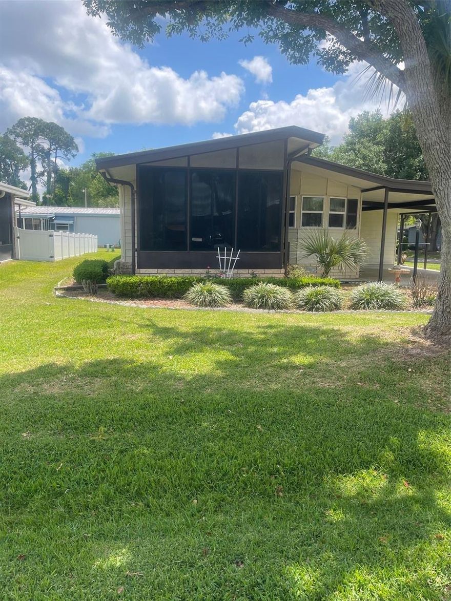 Boating and Fishing Enthusiasts welcome home!  Canal front community... Spacious 2 bedroom 2 bath home located at Fox Run in Tavares. There is a 12'x12' front enclosed Florida room to enjoy your evenings. Huge master bedroom, with dual closets and dual sinks in bath. Inside utility room equipped with washer and dryer. The kitchen is fully equipped. This home is fully furnished and vacant, just bring your suitcases and move right in. There is a workshop/shed and a huge carport. The Clubhouse provides a large room available for events, heated pool, fitness center, shuffleboard, and a park. There is a private boat ramp with canal access to Lake Harris and the Harris Chain of Lakes available only to residents. You may store your boat along the river side,  slips available to residents only. No need to store your boat.