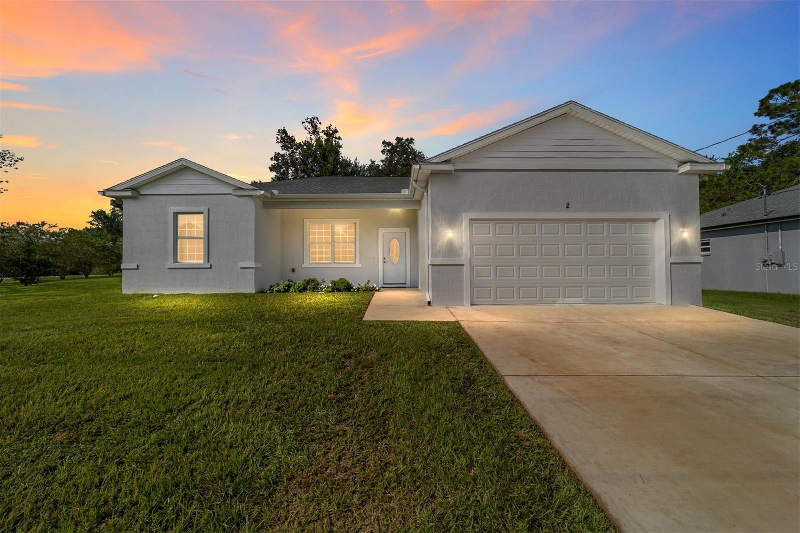 One or more photo(s) has been virtually staged. Welcome to this like New Home. NO HOA , NO CDD. You will be greeted by an Inviting Open Floor Plan with Vaulted Ceilings. This Gourmet Kitchen features a 36" Thor Stove with Pot Filler, Sleek Microwave and Farm house sink, Pull out Drawers for easy access and a Large Center Island with extra storage. French doors that lead to a Screened in Lanai with a Ceiling Fan. You also have Brick Paver Patio. Your Master Suite offers a Luxurious retreat with a Walk in Shower and Closet. Easy to clean tilt in windows . Home has been Freshly Painted. Driveway fits 2 cars side by side. Picture is from a previously built model.