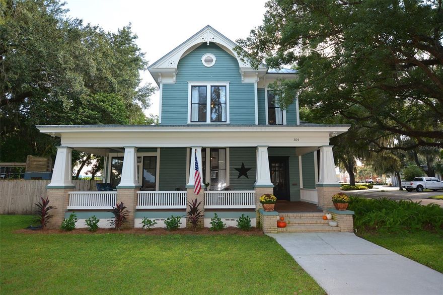 You must see this stunning 4 bedroom 3 bathroom home located in the heart of Bartow’s historic district. This 1898 home is one of the oldest houses in Bartow boasting 3,124 sqft of living area, 11ft high ceilings, crown molding, hardwood floors, built in bookshelves, exposed wood ceiling beams in living room, sun room, formal dining room, wood molding staircase, oak floors downstairs, pine floors upstairs, updated upstairs bathroom with glass shower doors, new A/C unit upstairs, large guest bedrooms, new ceiling fans, giant front porch, metal roof with new screws, new flat roof over carport, new carport floor paint, and a transferable termite bond. This home has large windows offering tons of natural light and incredible views of the courtyard and other surrounding historic homes. The spacious kitchen has recently been updated to include the conveniences of modern life with quartz countertops, stainless appliances, deep farmhouse sink, butlers pantry, and gas range. The ground floor master suite has a completely updated bathroom with walk in glass shower enclosure, walk in closet, shiplap walls, subway tiles, and dual sinks. The living room and family room areas are divided by double sided wood burning fireplaces. The sun room that overlooks the large sweeping front porch could easily be used as a fifth bedroom if needed. The home sits on a huge .34 acre corner lot in the middle of charming Bartow's Main Street District which offers restaurants, community events, and historic sites including the Polk County courthouse. Enjoy relaxing and entertaining outside with mature shady oaks, a large fire pit, brick patio, custom playhouse with climbing wall and swing-set, wood privacy fence, long driveway, double gate, rebuilt detached garage, new wood decking on front porch, workshop, and two car carport. The home is conveniently located to several shopping centers, grocery stores, restaurants, parks, Polk State College, and the Polk Parkway for easy commutes to Tampa and Orlando.