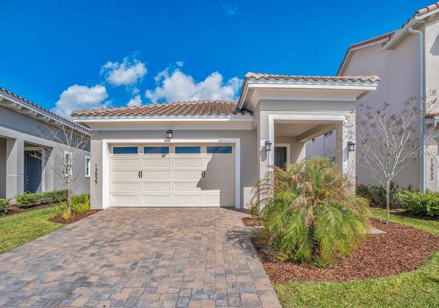 One or more photo(s) has been virtually staged. Built in 2023 and showing like new, this modern single-story home is located in the 24-hour guard-gated Eagle Creek Golf Community in Lake Nona. Featuring 3 bedrooms, 2 bathrooms, and a 2-car garage, the home offers a bright open-concept layout with contemporary finishes and a functional design for comfortable everyday living.

The gourmet kitchen features sleek cabinetry, ample counter space, and flows seamlessly into the living and dining areas—perfect for entertaining. Natural light fills the home and leads to a covered lanai, ideal for relaxing outdoors.

The private primary suite is thoughtfully separated from the additional bedrooms, offering flexibility for guests, family, or a home office. Additional highlights include a large laundry room, built-in storage, and a durable tile roof.

Residents of Eagle Creek enjoy resort-style amenities including a championship golf course, clubhouse with restaurant, pools, fitness center, tennis and basketball courts, playgrounds, and scenic walking paths. Zoned for top-rated schools and located just minutes from Lake Nona Medical City, Lake Nona Town Center, Boxi Park, Orlando International Airport, and SR-417.

Move-in ready and better than waiting for new construction. Schedule your private showing today.