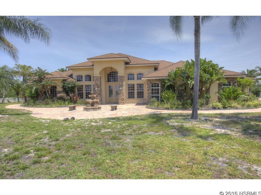 Located in the heart of New Smyrna Beach this 4/3 2700+sqft home is nestled on 7 acres and offers the best of country living with the beach minutes away. The home features a large dining area, living area, and master bedroom. The home also features a gourmet kitchen with granite counter tops and a breakfast bar. Relax out by your salt water pool and enjoy your lush landscape. Large out building that could be a guest cottage, extra storage or workspace. Tile floors though out, Vaulted ceilings and light bright rooms make this a terrific family home or ranch retreat.Come live the NSB Lifestyle in your new home! All measurements are intended to be accurate but should be verified.