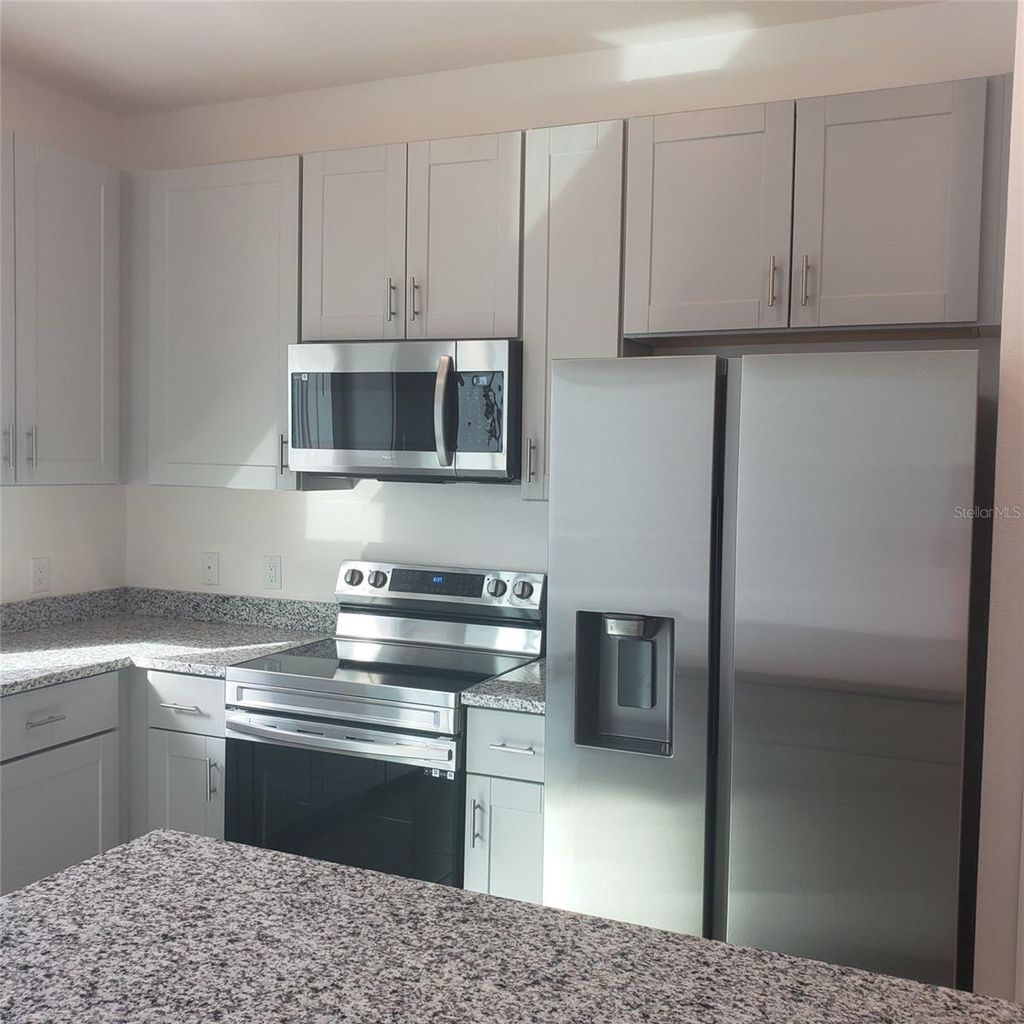 Photo of 34218 Rogallo Lane, Wesley Chapel, FL 33545 (MLS # TB8486640)