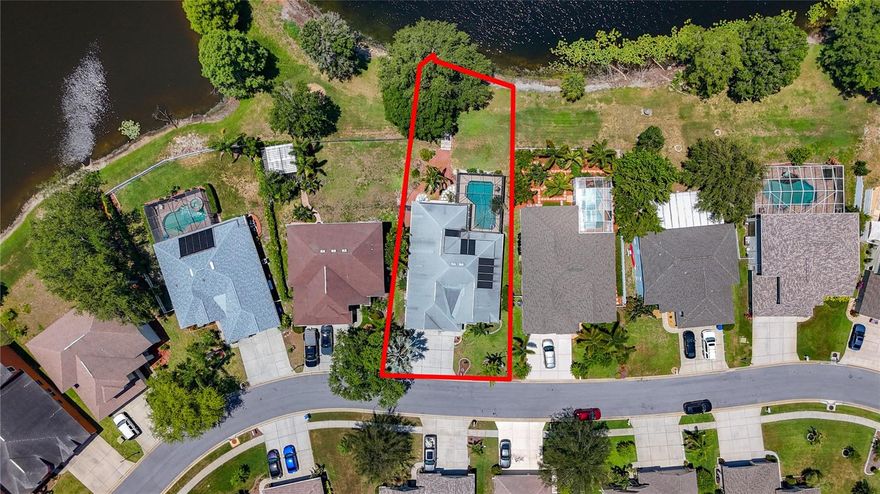 Lakefront Pool Home in Gated Community – Not in a Flood Zone!

Welcome to your private retreat in the heart of Holiday, Florida! This beautifully updated 3-bedroom, 3-bathroom home is located in a gated community and offers the best of Florida living—plus peace of mind, as it's in one of the few areas not located in a flood zone.

Inside, you'll find new flooring throughout and a flexible private office that can easily serve as a fourth bedroom, media room, or home workspace. Step outside to your own private inground pool overlooking a serene lake, complete with a newly painted pool deck, perfect for relaxing or entertaining.

The community itself is packed with amenities, including:

Tennis courts

Community pool

Dog park

Walking and biking trails

Enjoy the natural beauty of nearby parks like Anclote River Park with its beach and boat ramp, Key Vista Nature Park for hiking and nature walks, and Anclote Gulf Park, located right on the Gulf with a fishing pier and pet-friendly spaces.

You're also close to local fishing charters, museums, shopping, and dining. The charming sponge docks and Greek cuisine of Tarpon Springs are just minutes away, and Clearwater Beach—known for its white sand and turquoise waters—is a short drive down the coast.

This home combines privacy, comfort, and convenience in a vibrant Florida community. Schedule your private showing today—your lakefront oasis awaits!