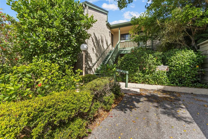 This stunningly remodeled 3 bed/2 bath condo features soaring cathedral ceilings, clerestory windows, generous open floor plan with a high-capacity AC system, water heater, and tile flooring throughout. Simply move-in and take in the tranquil Little Sarasota Bay and marvel at the dolphins, manatees, birds, and other wildlife. Enjoy incredible sunsets and star gazing in the evenings from your living room. This bright and peaceful second-floor unit is located within the 75-acre, botanic garden-like setting of Pelican Cove. The historic Wilbanks clubhouse is only steps away, where the main heated resort-style pool awaits. Across the way is the private picturesque 87-boat slip harbor. Boat and kayak to Midnight Pass and have direct access to the gulf! Residents gain entry to the unique blend of natural habitats, miles of scenic trails, a fitness room, multiple heated pools and hot tub. There are six new pickle-ball courts and resurfaced tennis courts with active clubs for play. Many more recreational and cultural events are hosted year around. Robust live music, art and culture, and educational seminars are abundant in season. The community is also conveniently located with shopping and restaurants near by. Siesta Key and downtown Sarasota are in very close proximity. You will love this phenomenal unit in this one-of-the-kind, gated, maintenance-free living community of Pelican Cove.