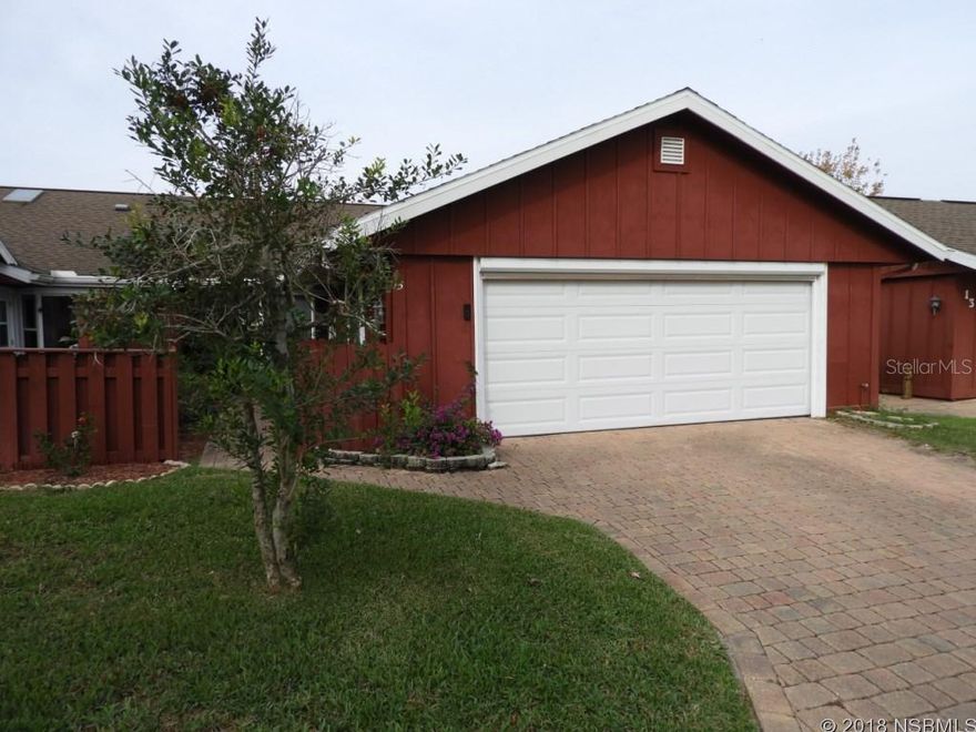 Golf Villa is priced affordably and ready for new owners. Updated kitchen with bay window overlooking entry courtyard, new wood cabinets, tile backsplash  and new counters, as well as newer appliances. Spacious great room enjoys light from skylight, and leads to Florida room and private patio to enjoy the outdoors. New 2.5 ton/14 seer AC system, new in 2016. New 2013 water heater. Architectural shingle roof 2006. Master suite features another bay window for lots of natural light. Guest bedroom has 2 closets for lots of storage. Screened entry porch has ornate entry gate and tiled floor. Nestled between 2 golf courses, and walking distance to community heated pool, available by optional membership to Fairgreen residents. Central location, close to shopping, dining, downtown New Smyrna Beach and minutes to the beach. Nominal HOA dues provide termite bond and irrigation system and water to it. Easy to see, call to take a look! ;Water: City