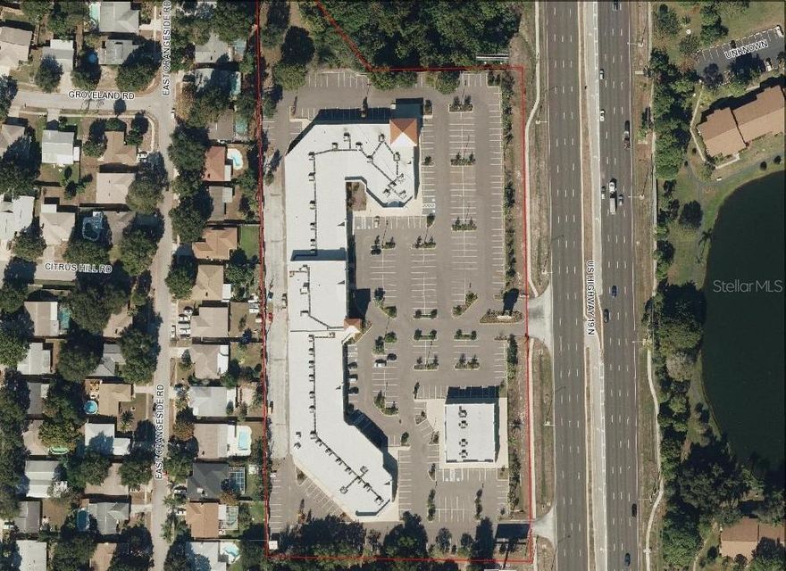 Investment Property, great for a 1031 Tax Exchange. in Prime Location on the West Side on US 19. just one block south of Alderman Road. High visibility, with 752 feet  Frontage, on US Hwy 19. The Main Building is a mix of Retail Spaces 66,587 sqft. plus 7700 sqft. Office Space on the second floor, with a Private Elevator. An additional Out-Parcel Building of 8086 sqft. brings the Total to 82,373 sqft. The parking ratio is 4.25.  The lot size is 7.3 acres, plus 3 additional Lots of 3.11acres, for a total of 10.4 acres.  Please contact Listing Broker for rent-roll and more information.