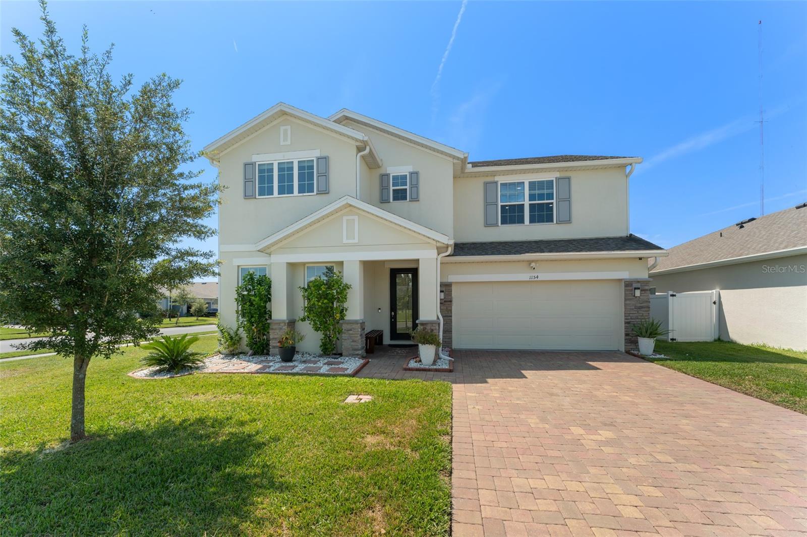 **This house comes with a REDUCED RATE through the seller's preferred lender. This is a lender-paid rate buydown that reduces the buyer's interest rate and monthly payment.** Welcome to this meticulously maintained 5-bedroom, 3-bathroom home perfectly situated on a PREMIUM CORNER LOT in the highly desirable Celery Oaks community. This home blends spacious living with thoughtful upgrades for the lifestyle today’s buyers are looking for. Step inside to the open Wilshire floor plan with tile flooring throughout the main level and dual-pane windows offering comfort and efficiency. The gourmet kitchen boasts 42" cabinetry, pantry storage, STAINLESS STEEL appliances including a Samsung Smart refrigerator, and a breakfast bar flowing seamlessly into the dining area, ideal for intimate family gatherings or entertaining. The first floor offers versatility with a family room, a private office/living room, and a guest bedroom with access to a full bathroom. Upstairs, a double-sized loft creates endless possibilities for a playroom, media room, or lounge. Four additional bedrooms include a generous sized primary bedroom with an ensuite with dual sinks and a large walk-in closet, along with a conveniently located laundry room. Step outside to a screened lanai and an expansive concrete pad ideal for setting up a pergola or gazebo, for year round entertaining. Celery Oaks residents enjoy convenient access to the Riverwalk and downtown Sanford, Lake Monroe, Central Florida Zoo and Botanical Gardens, Spring Hammock Preserve, Seminole Towne Center, the Sanford International Airport, major medical facilities, and numerous dining, shopping and entertaining options. Schedule your private showing today!