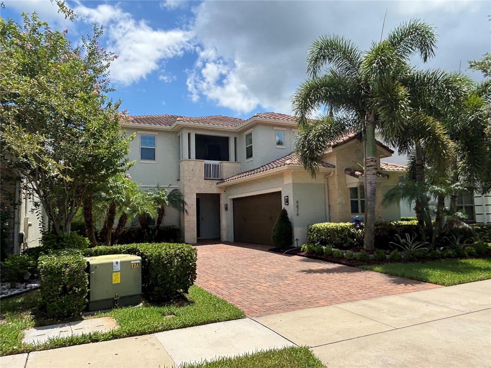 Step into refined elegance at this beautifully upgraded 4-bedroom, 3.5-bathroom residence nestled in the guard-gated community of Eagle Creek. Ideally located in the heart of Lake Nona, this exceptional home masterfully blends contemporary design with luxurious finishes, offering an elevated lifestyle designed for both relaxed living and upscale entertaining. The open-concept layout is enhanced by incredible illumination throughout the home, with customizable lighting that highlights architectural details and creates the perfect ambiance in every space. At the heart of the home, a showstopping chef’s kitchen features two expansive islands with individual lighting control, top-of-the-line Gaggenau appliances including a built-in oven and microwave, a sleek Zephyr range hood, and a built-in ice machine, making it the ideal space for culinary creativity and entertaining. The adjacent living area boasts a true statement piece — a luxurious enclosed wine cellar, beautifully integrated into the space to both display and preserve your finest collection. Step outside to your personal oasis: a fully equipped outdoor summer kitchen with a built-in grill, and a heated saltwater pool surrounded by lush landscaping — the ultimate setting for private relaxation or unforgettable gatherings. Every inch of this home reflects thoughtful luxury, from its premium upgrades to its smart functionality. Located just minutes from Medical City, Orlando International Airport, and world-class dining and shopping, the home also offers effortless access to SR-417, SR-528, and Narcoossee Rd, placing all of Central Florida within easy reach.