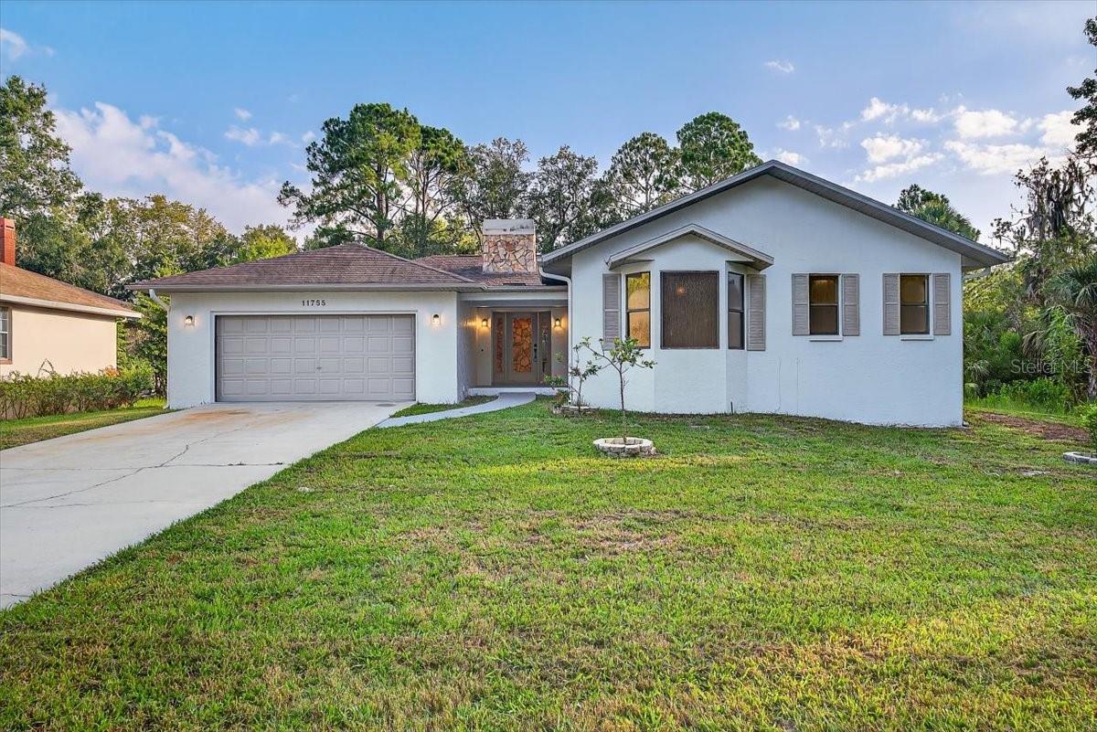 WOW! Charming 3 bedroom/ 2 bathroom POOL home with a BONUS room and 2-CAR garage situated on 0.37 acres in beautiful Homosassa! Experience and enjoy exciting water activities such as fishing charters, kayaking, and boat tours along the Homosassa River and beaches on the Gulf coast as this home is close to the water but located on a HIGH AND DRY lot!!! HOME DID NOT FLOOD DURING 2024 HURRICANCES MILTON AND HELENE!! Cozy up by the stone fireplace during cooler Florida nights or take a dip in the pool during those hot Florida Summers!! Great layout with a split floorplan. Large master bedroom with a walk-in closet and updated ensuite featuring a stand-in shower with a rainfall showerhead. Tile floors in kitchen and baths with new vinyl flooring in living, dining, beds and hall. Kitchen has granite countertops, plenty of cabinet space, a center island and stainless-steel appliances! Sliding glass doors in the living room and dining area open up to a large, covered lanai and back patio with a wonderful swimming pool protected by a pool cage. HUGE backyard fenced in with charming wooden fencing. Newer 2023 HVAC, 2012 Roof in good condition. LOW POA fees to keep the community clean and well-maintained. Schedule a showing now!