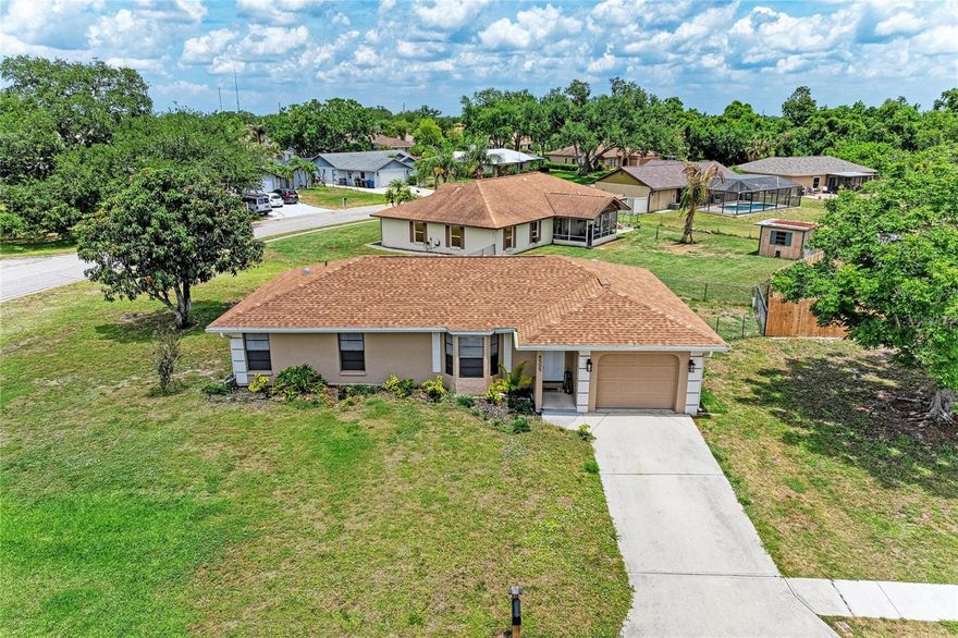 No HOA in this East Bradenton neighborhood! This home has many new features, such as a new roof (2023), a new septic drain field (2023), a new HVAC (2024), new water heater (2023), new front door (2025) and new flooring throughout living area and dining room (2023). There are two bedrooms and two bathrooms on an oversized corner lot. Plenty of opportunities to make it your own! Near shopping, schools, and near US 301 and 44th Ave E for easy commute.