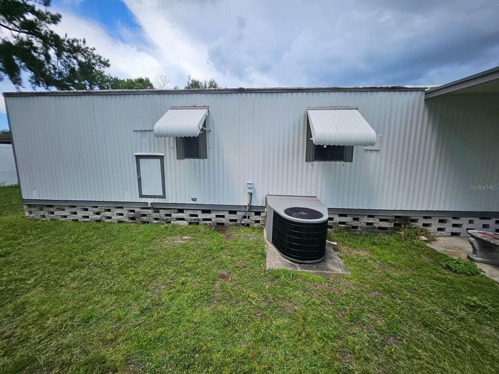 Photo of 6445 Belle Terre Rd, New Port Richey, FL 34653 (MLS # TB8495611)