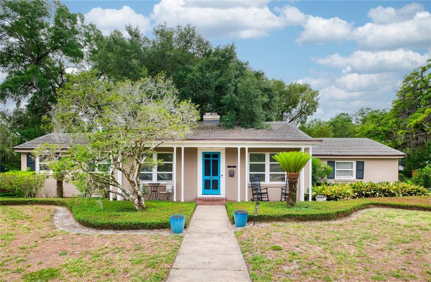 This classic 1950s ranch-style property features a main house, attached three-car garage, and an attached in-law suite/apartment complete with a private entrance and separate parking pad. The main residence offers three bedrooms, a dedicated office, three full baths, and expansive living spaces designed for comfortable everyday living and entertaining. A full laundry room is conveniently located just off the back entry with direct access to the garage area. The formal living room showcases timeless character with gleaming hardwood floors, detailed crown molding, and a classic brick fireplace framed by custom built-ins and display shelving.  The adjoining dining room features rich hardwood floors, paneled walls, designer lighting, and a vintage built-in hutch with extensive shelving and storage, offering both architectural charm and functional display space. Together, these connected spaces blend traditional craftsmanship with comfortable elegance. A bright and functional kitchen with an abundance of cabinetry, expansive counter space, and a large center island ideal for meal prep includes a charming, old world wine nook featuring exposed reclaimed style brick walls and custom wood wine rack designed for bottle storage.  Enjoy family time or entertaining in the expansive window-lined family room designed to bring the outdoors in featuring walls of oversized window overlooking the private backyard and garden paths.  Rich wood beams and trim add architectural interest and warmth. Enter the private primary suite through a dedicated pine paneled hallway lined with three storage closets, offering fantastic storage opportunities not usually found in a 1950’s style home. The spacious primary bedroom also features generous closet space, creating a comfortable private space. The spacious primary bath featuring an oversized double-sink vanity with storage, rich wood cabinetry, and a striking exposed brick accent wall that adds warmth and character.  The oversized walk-in shower is finished with neutral tile and a glass enclosure.  The attached in-law suite is ideally positioned beside the three-car garage and features a private entrance along with its own dedicated patio space. The suite offers a spacious open room, an updated and charming kitchenette, full bath with shower, and a large closet, making it ideal for guests, extended family, or flexible living arrangements. Outside, the private backyard is framed by mature landscaping and charming brick garden walkways, creating a peaceful outdoor setting. Situated on a combined .35-acre double lot, the property includes two separate parcels measuring approximately 55.75 x 143.6 and 50 x 143.6 Zone R2/A/T